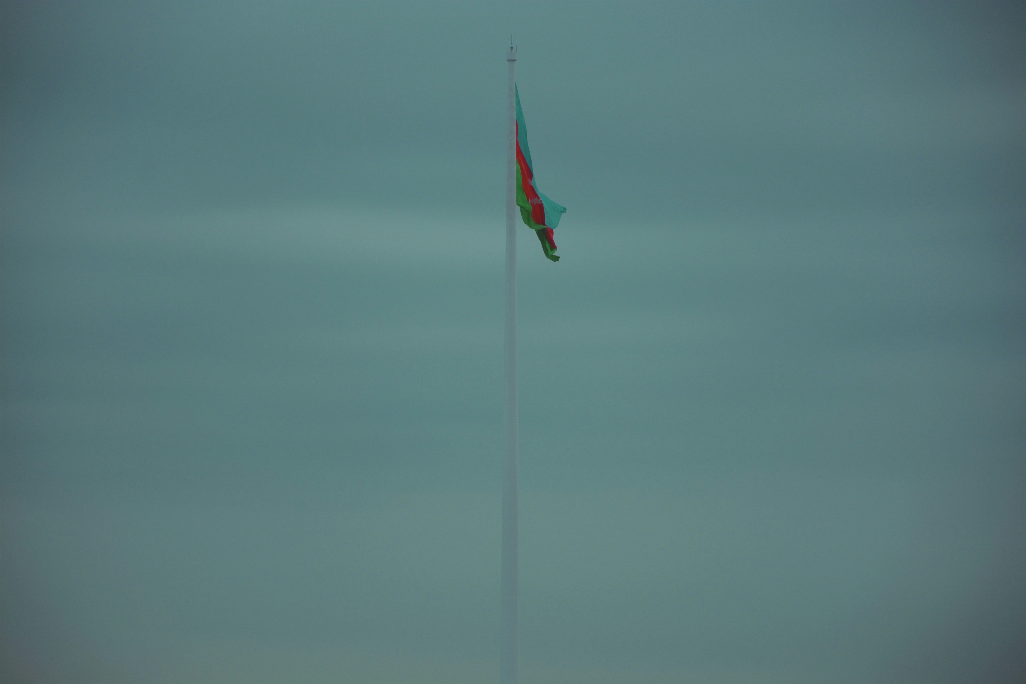 A kite flying high in the sky