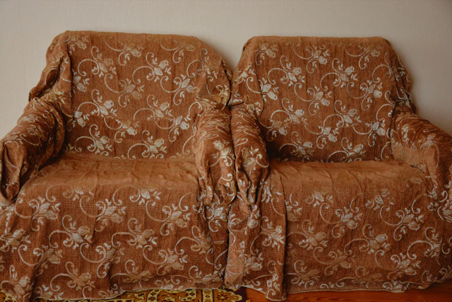Two armchairs with floral throws