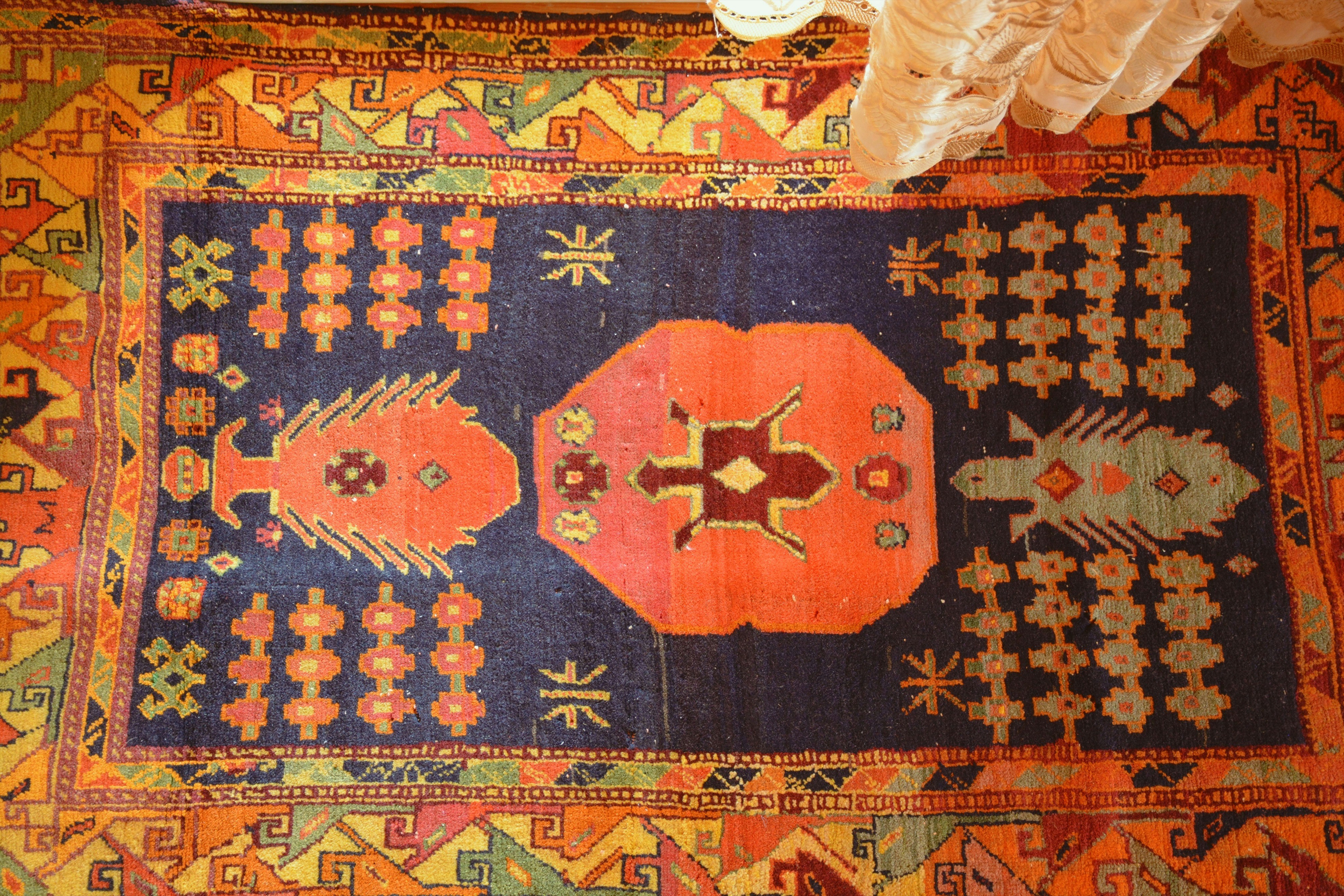 A colorful oriental rug with intricate patterns