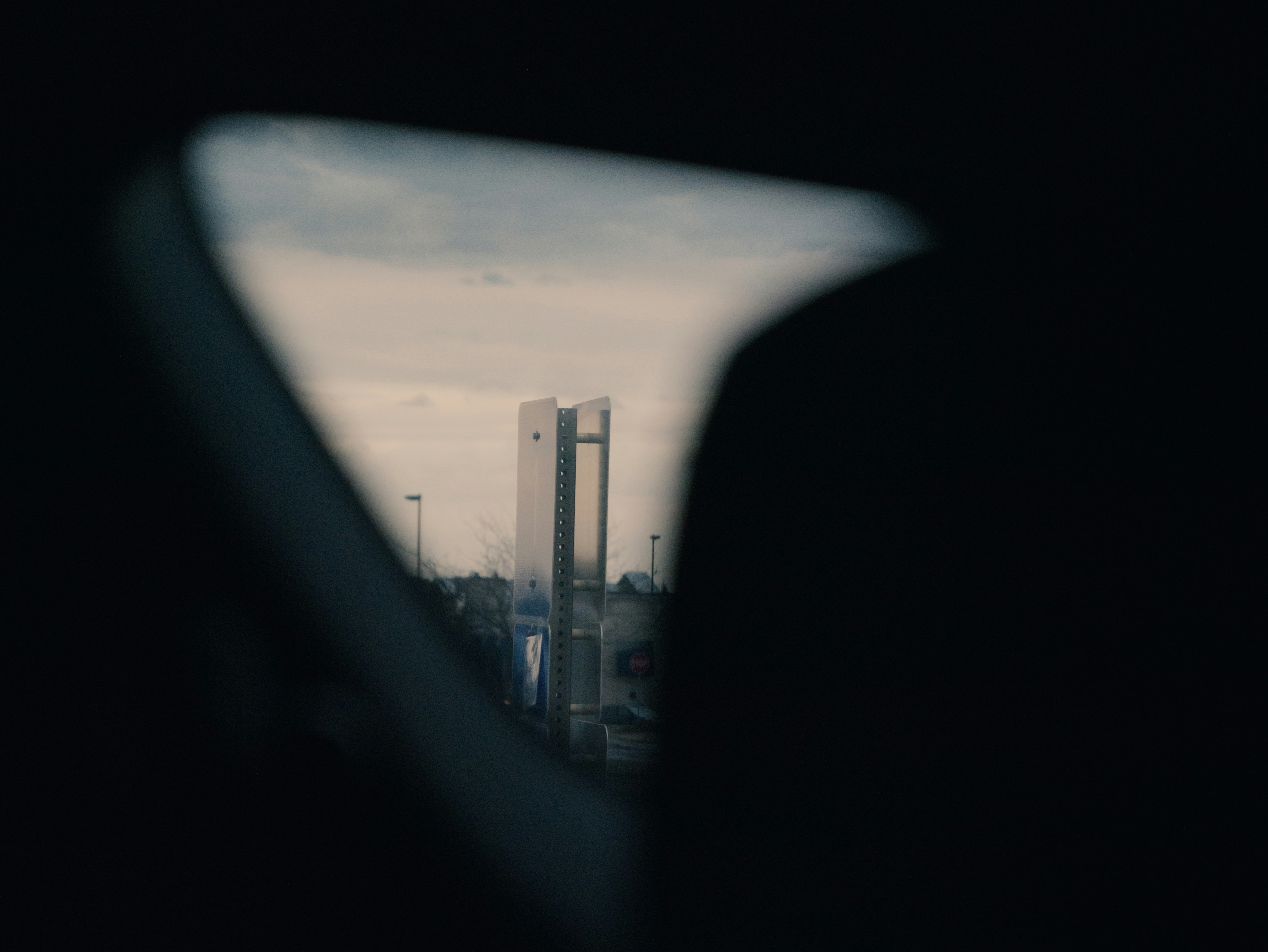 Tall modern building seen through a car window