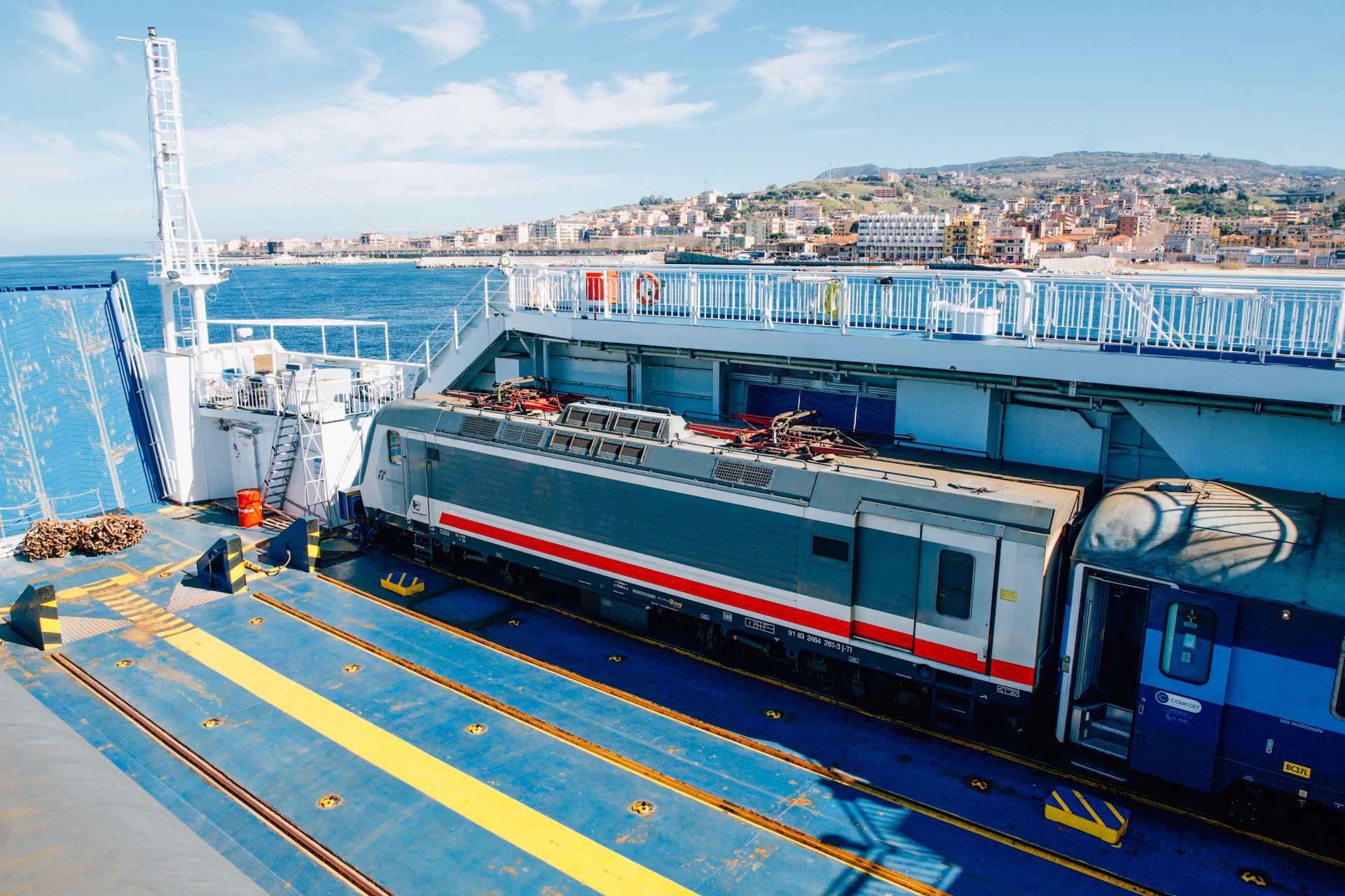 Train on a ferry crossing the sea