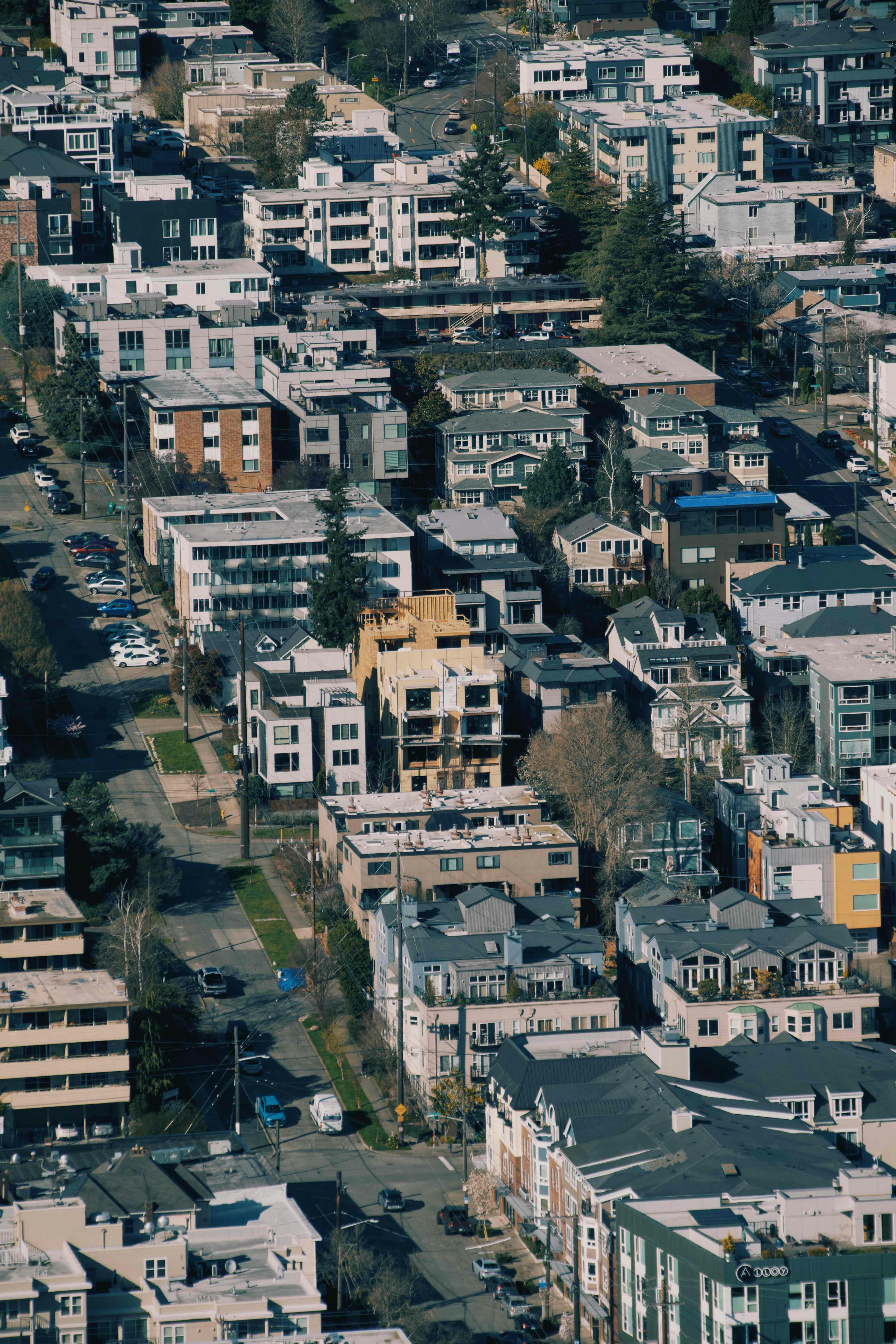 Aerial view of a dense urban neighborhood with varied buildings.