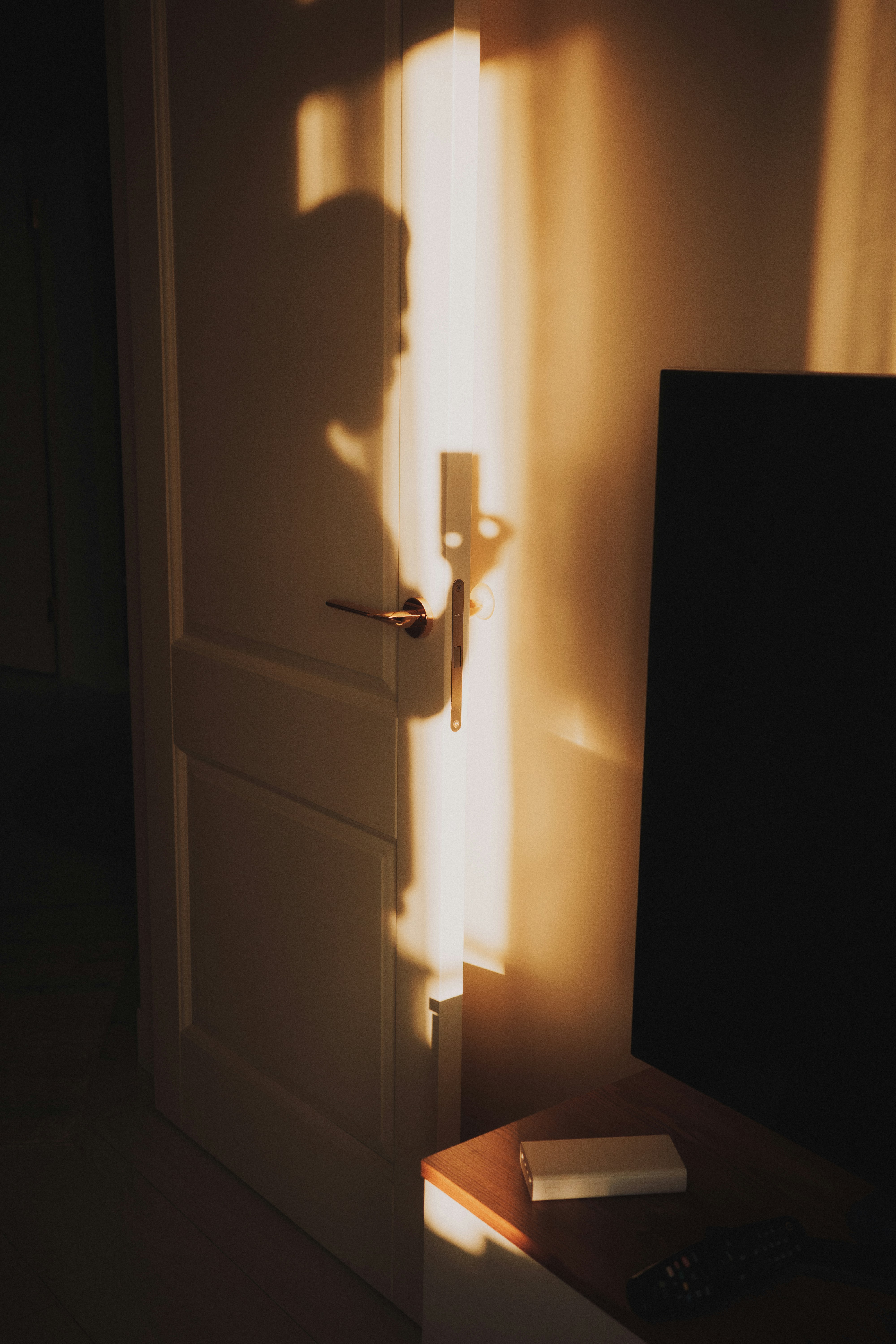 Shadow of a person on a wall near a door.