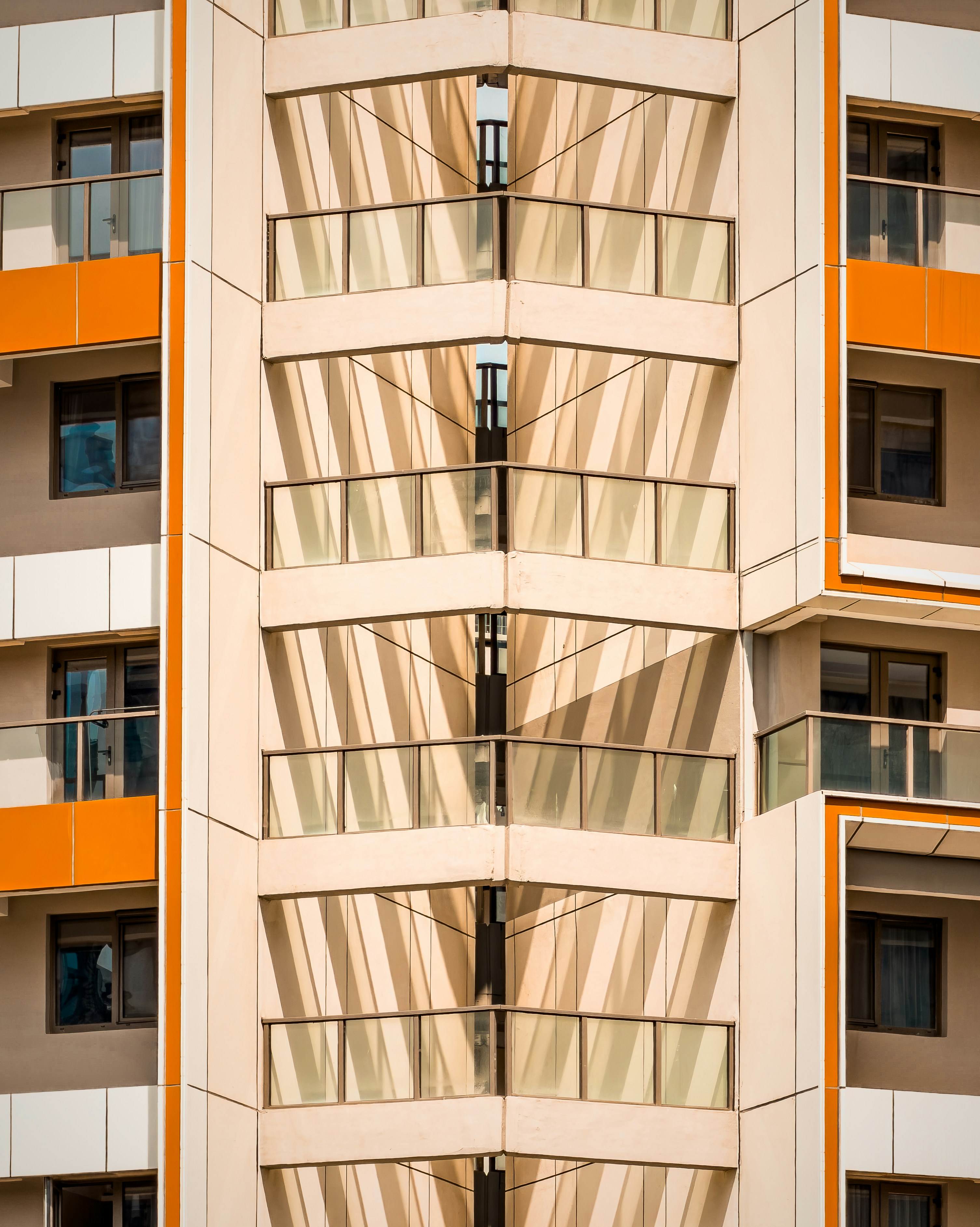 Modern building facade with geometric patterns and balconies