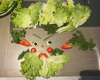 Vegetable face made from lettuce, peppers, and olives