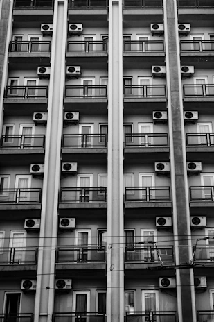 Rows of air conditioning units on a building facade