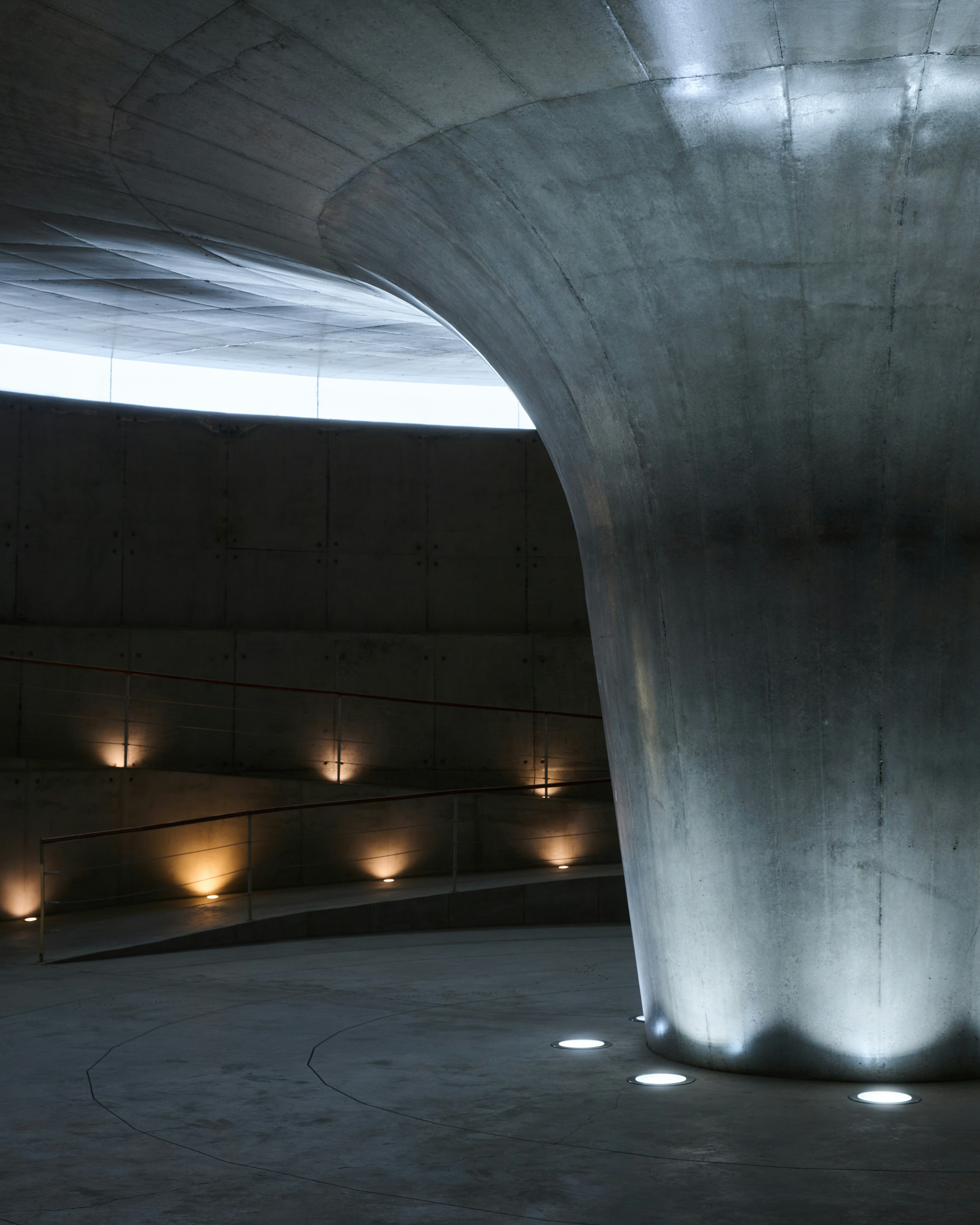 Modern concrete interior with dramatic lighting