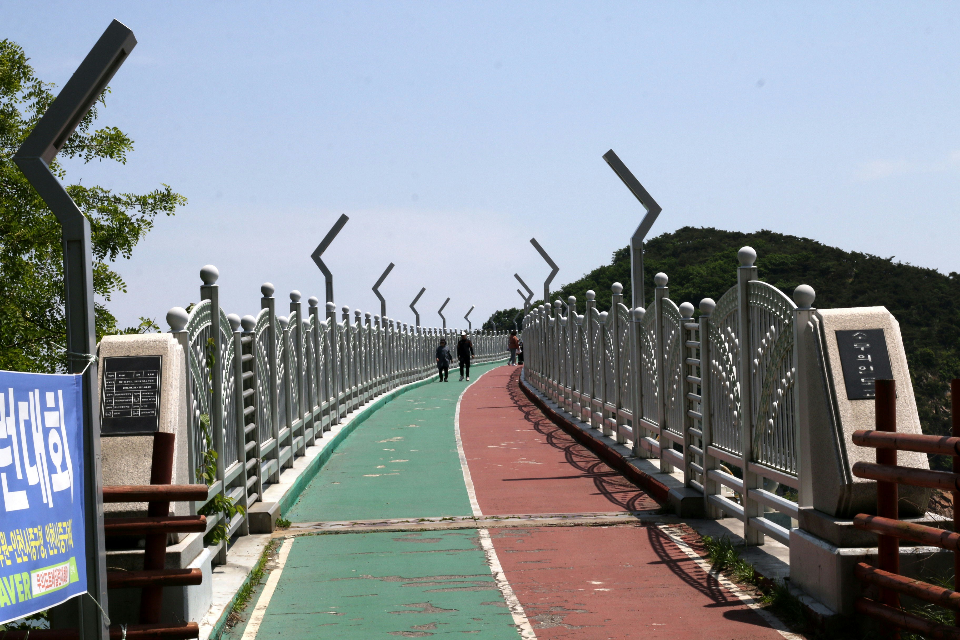 A scenic elevated walkway with decorative railings.