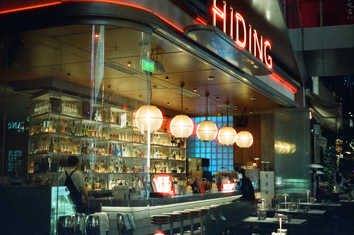 Street scene with a cyclist passing through evening light