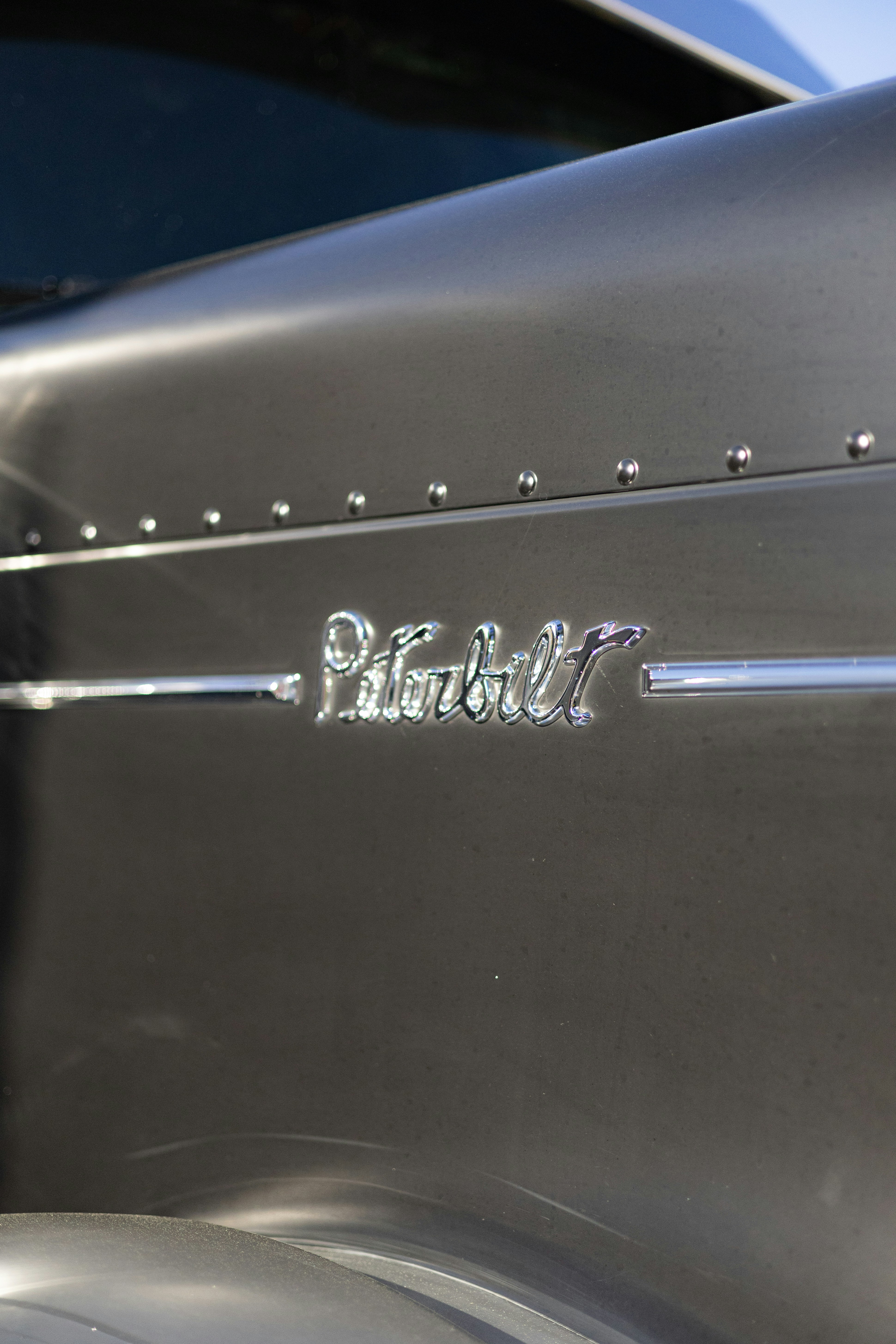 Close-up of a polished Peterbilt emblem