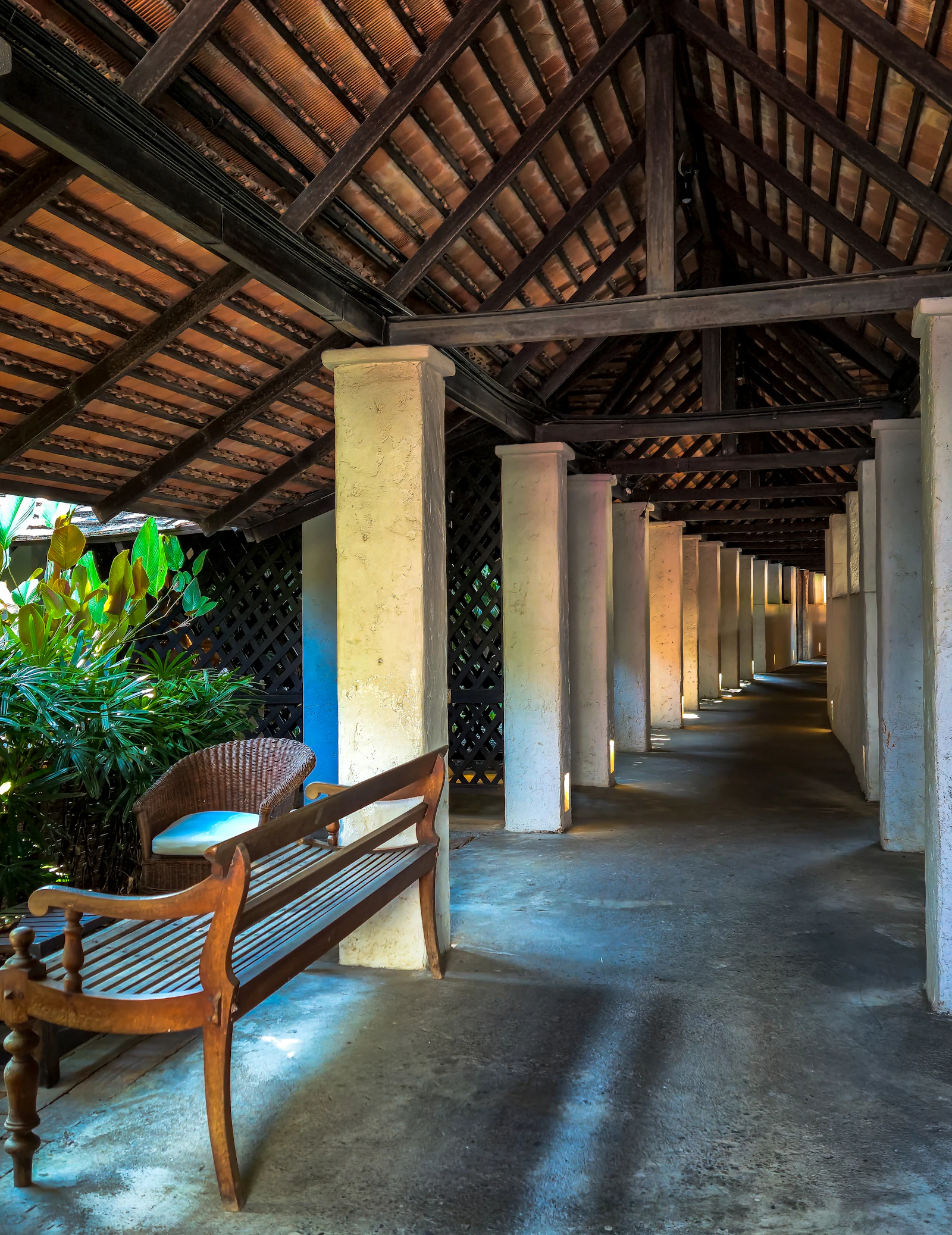 Covered walkway with built-in wooden bench seating