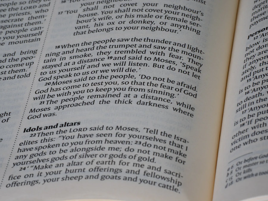 A close-up of an open Bible with visible text
