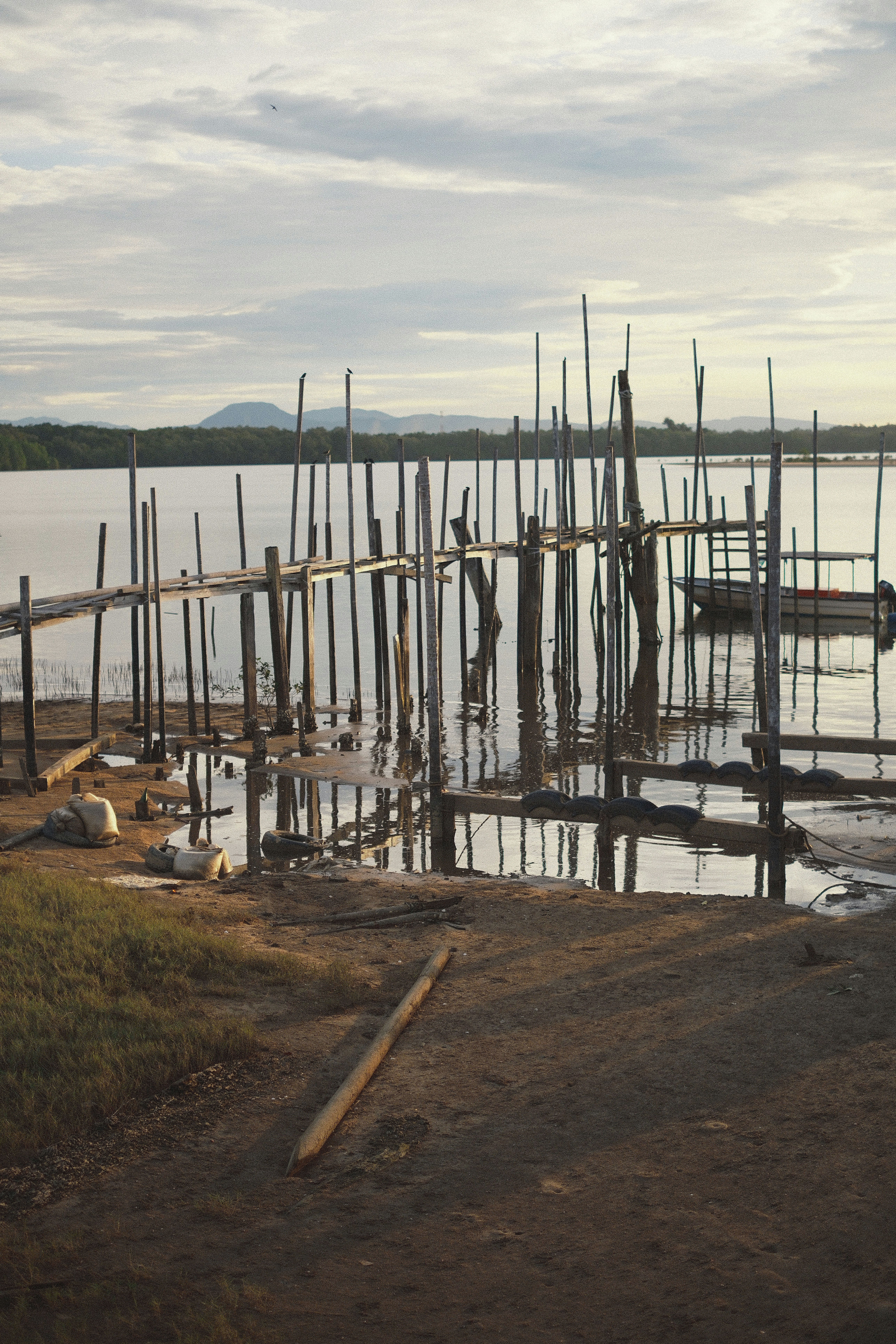 Wooden pier on a calm lake at sunset