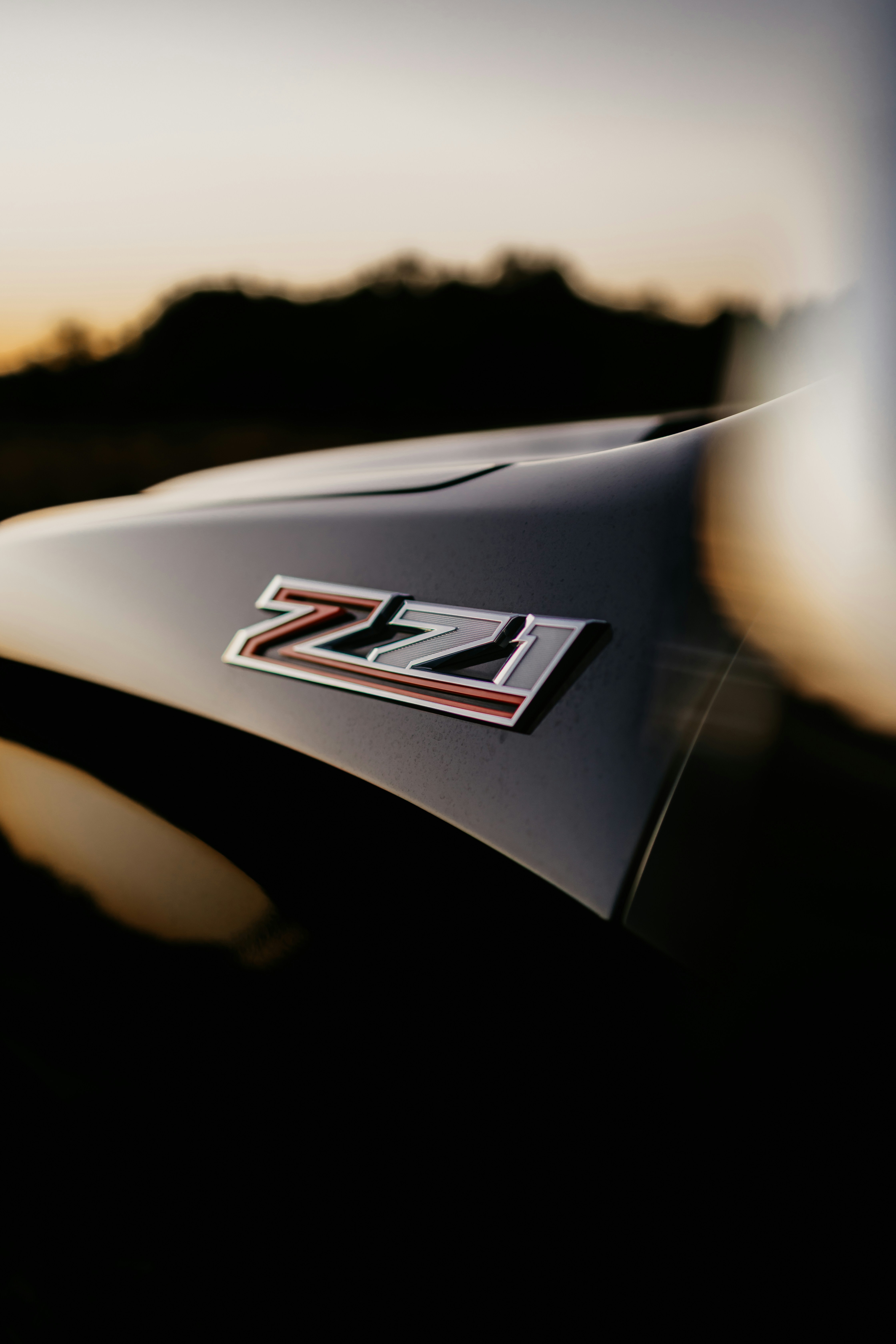 Close-up of a z71 badge on a car at sunset