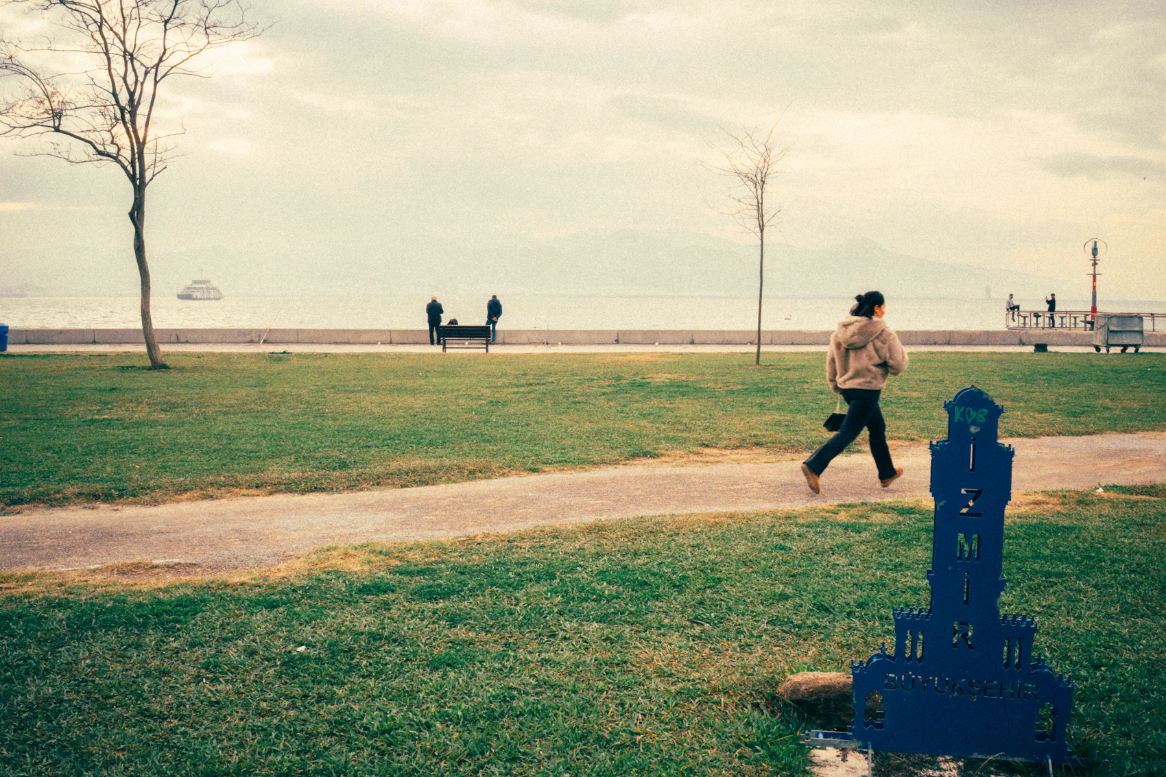 Person jogging along a seaside path during an everyday outdoor run