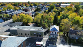 Aerial view of a small town with autumn foliage.
