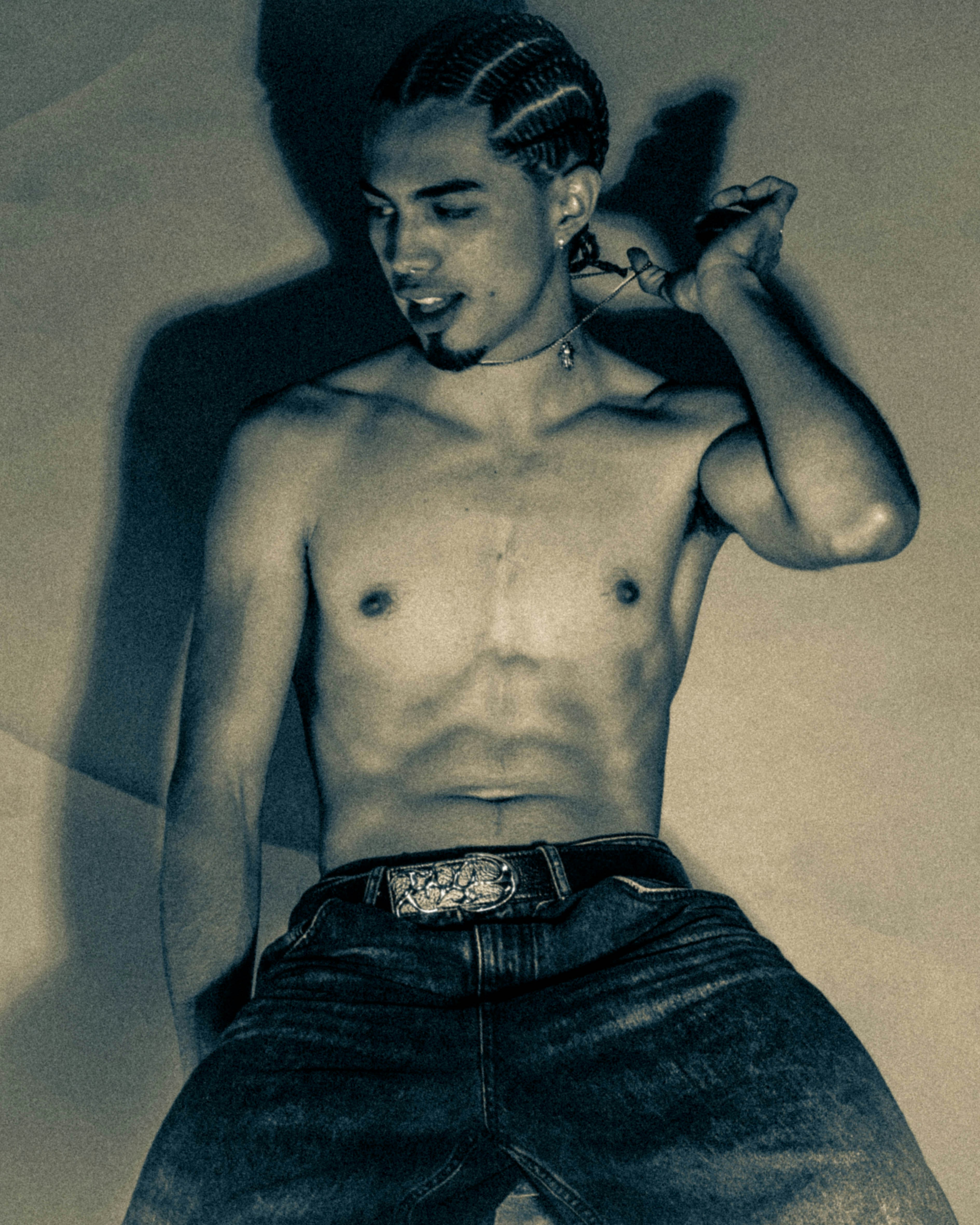 Man with braided hair and jeans