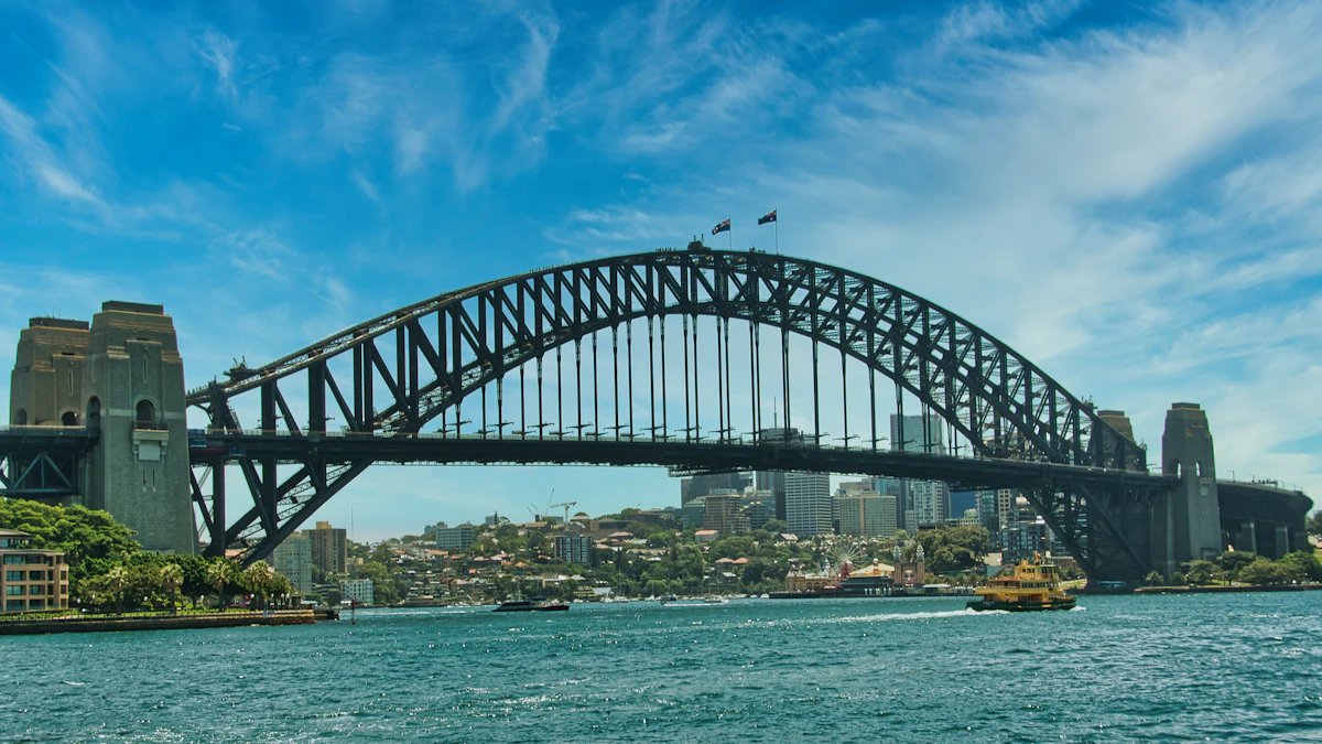 Sydney Harbour Bridge and a ferry under a clear blue sky