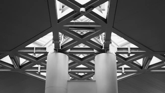Modern architectural structure with geometric patterns and pillars.