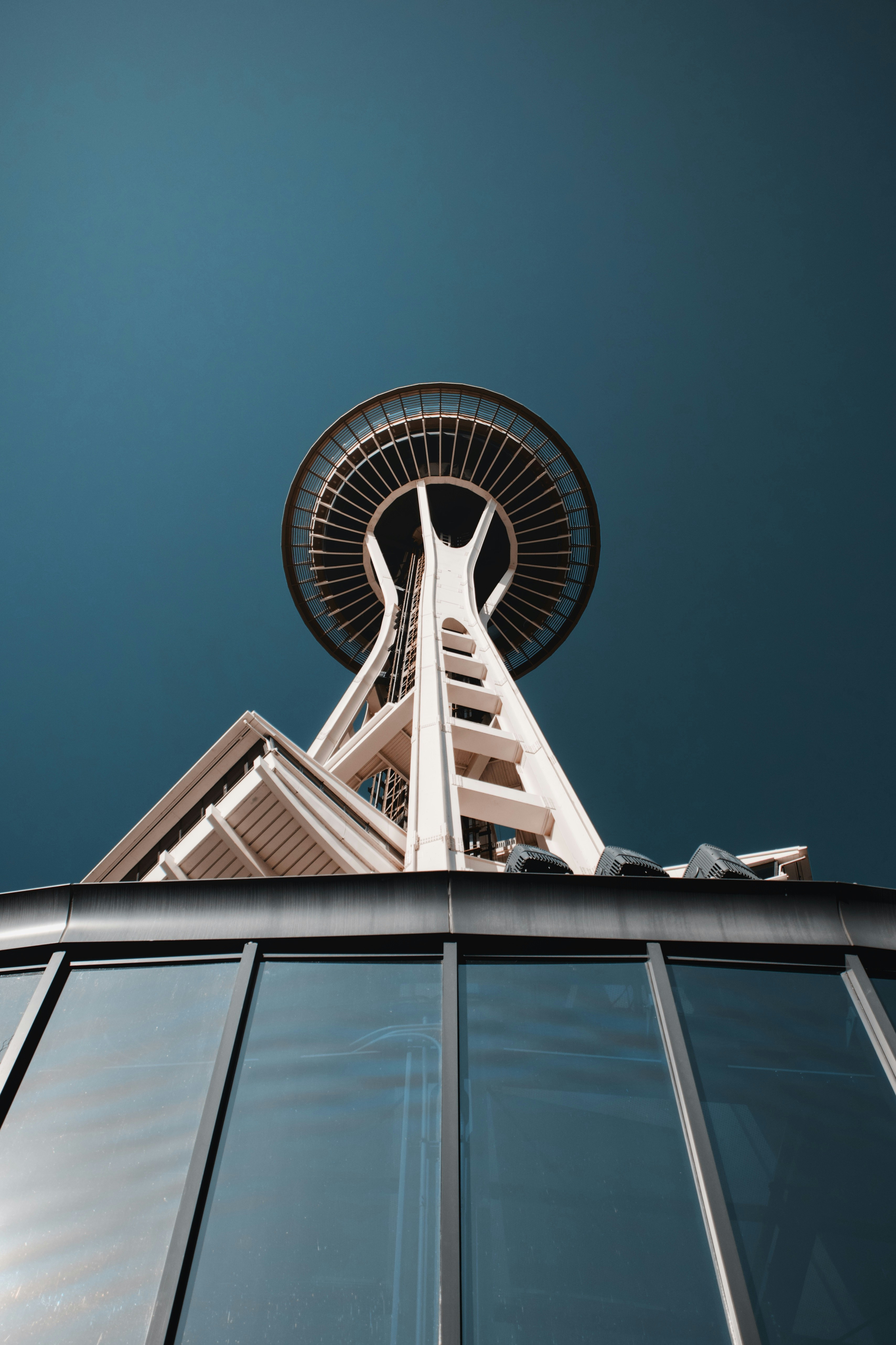 Space needle landmark against a clear blue sky