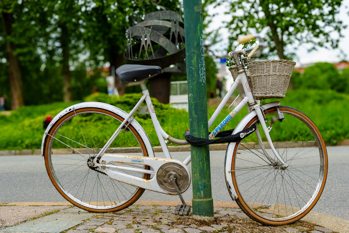 City bicycle with a practical front basket parked on an urban street