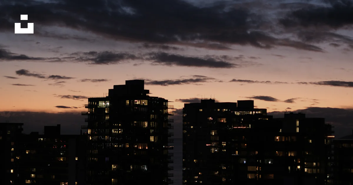City skyline at dusk with illuminated buildings