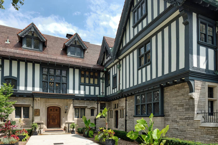 Half-timbered Tudor mansion courtyard with stone facade — Greenwich