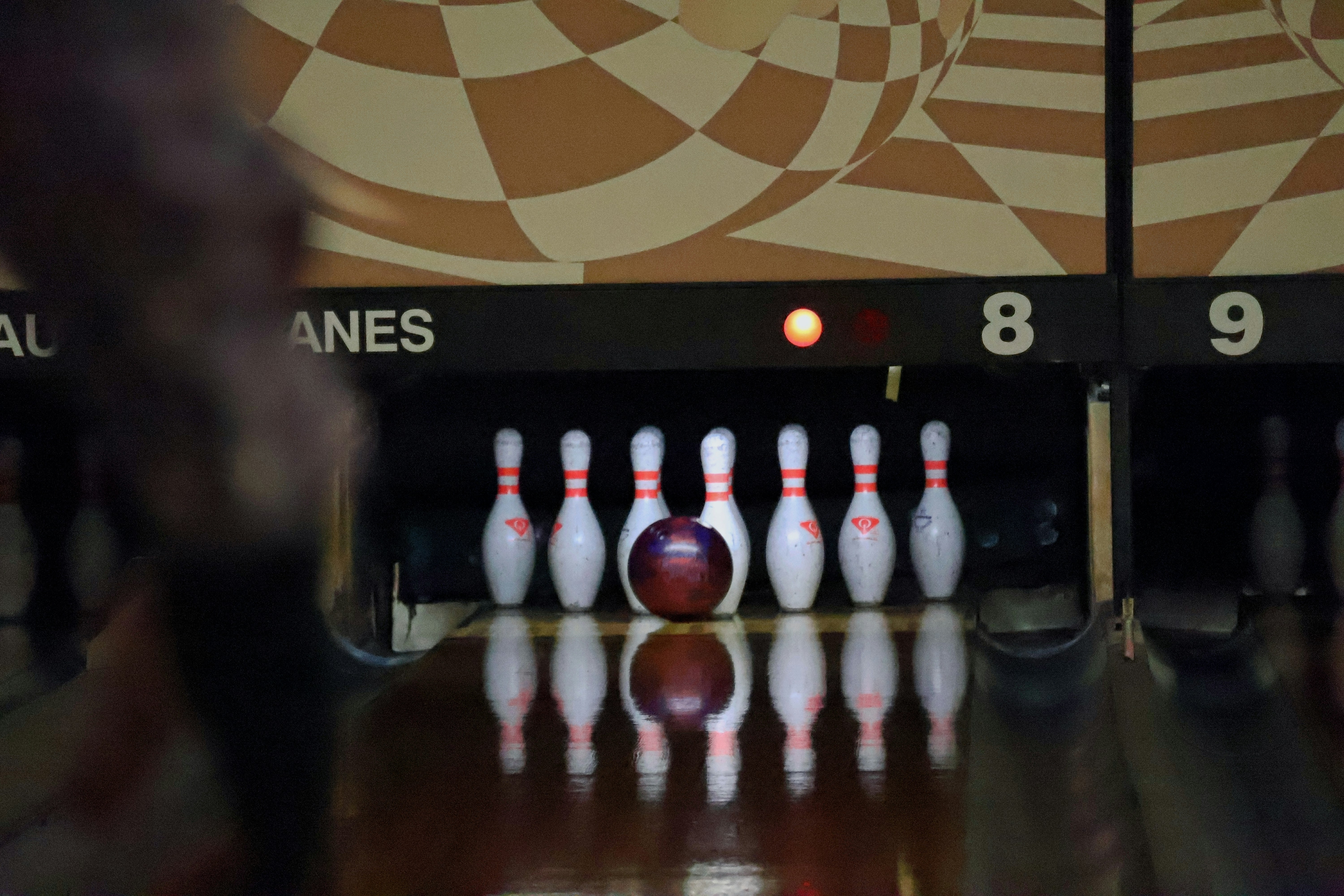Bowling pins and ball on a lane