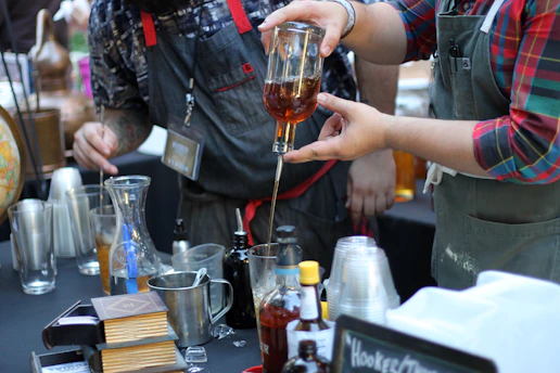 Bartenders preparing drinks at a bar