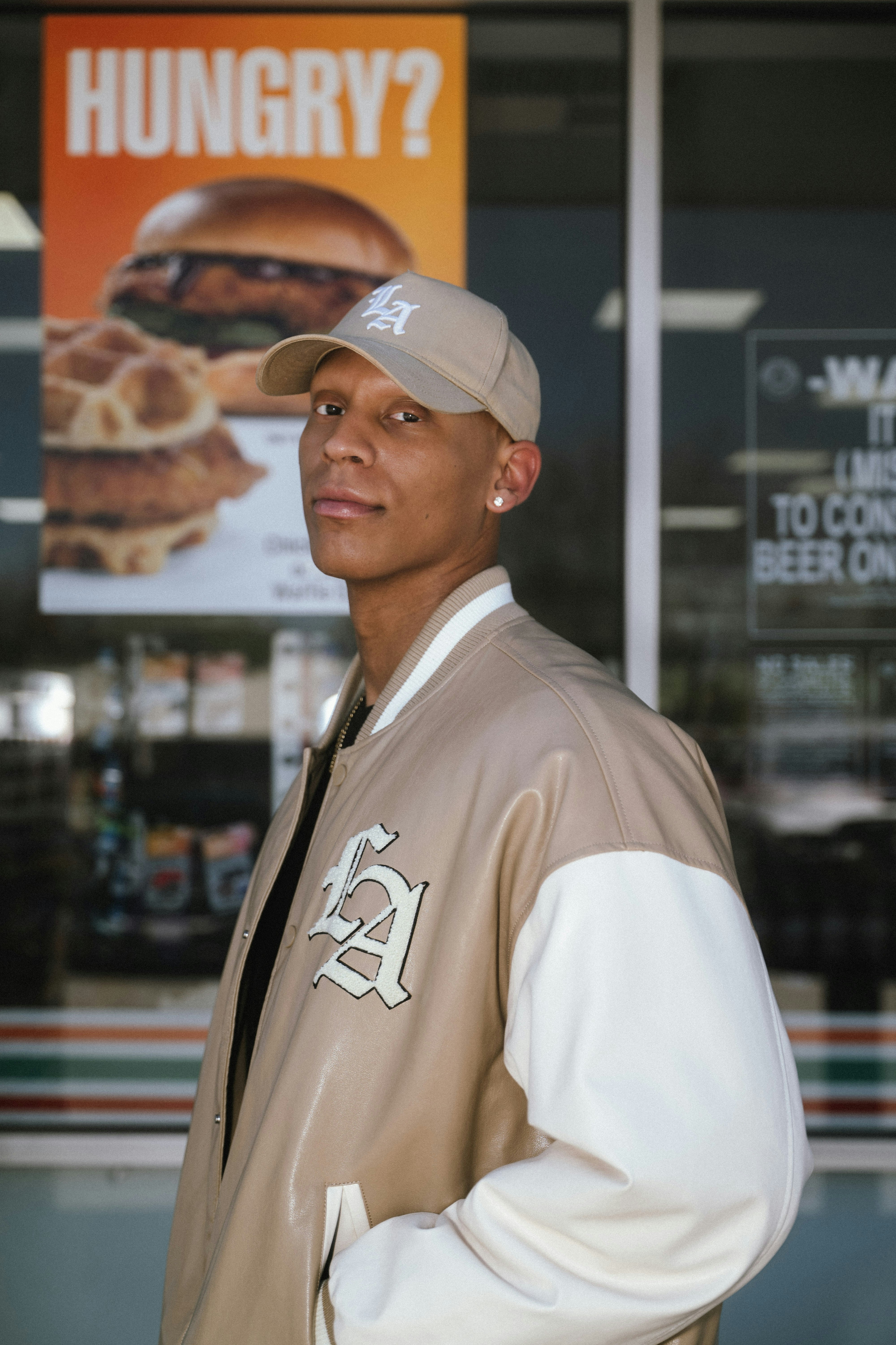 Man wearing a baseball cap and jacket