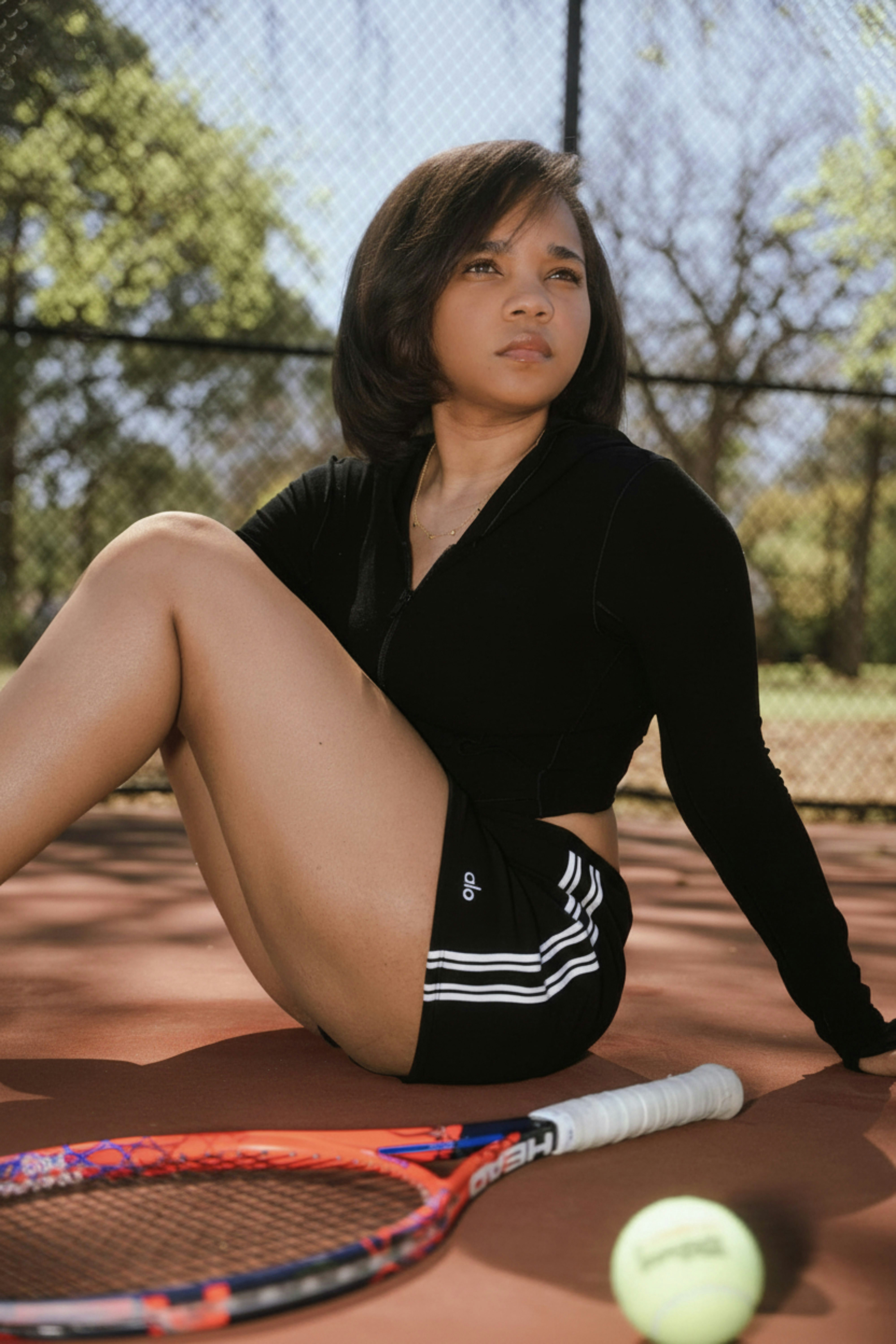 Young woman in athletic wear on tennis court