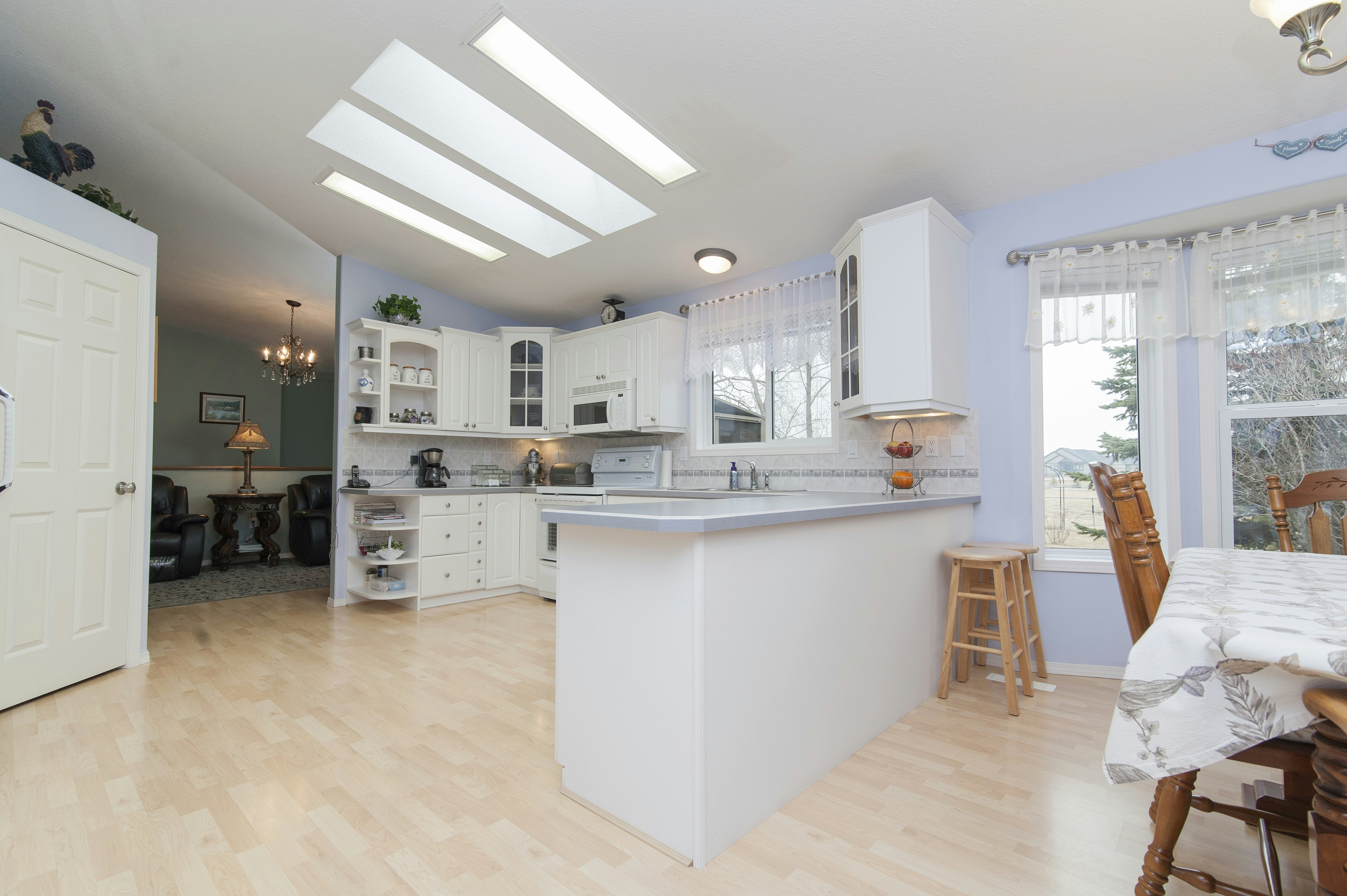 A bright, modern kitchen with white cabinets and island. photo – Free ...
