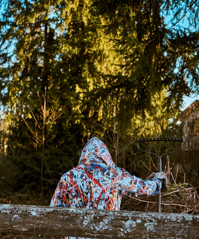Spring & fall cleanup — person raking autumn leaves
