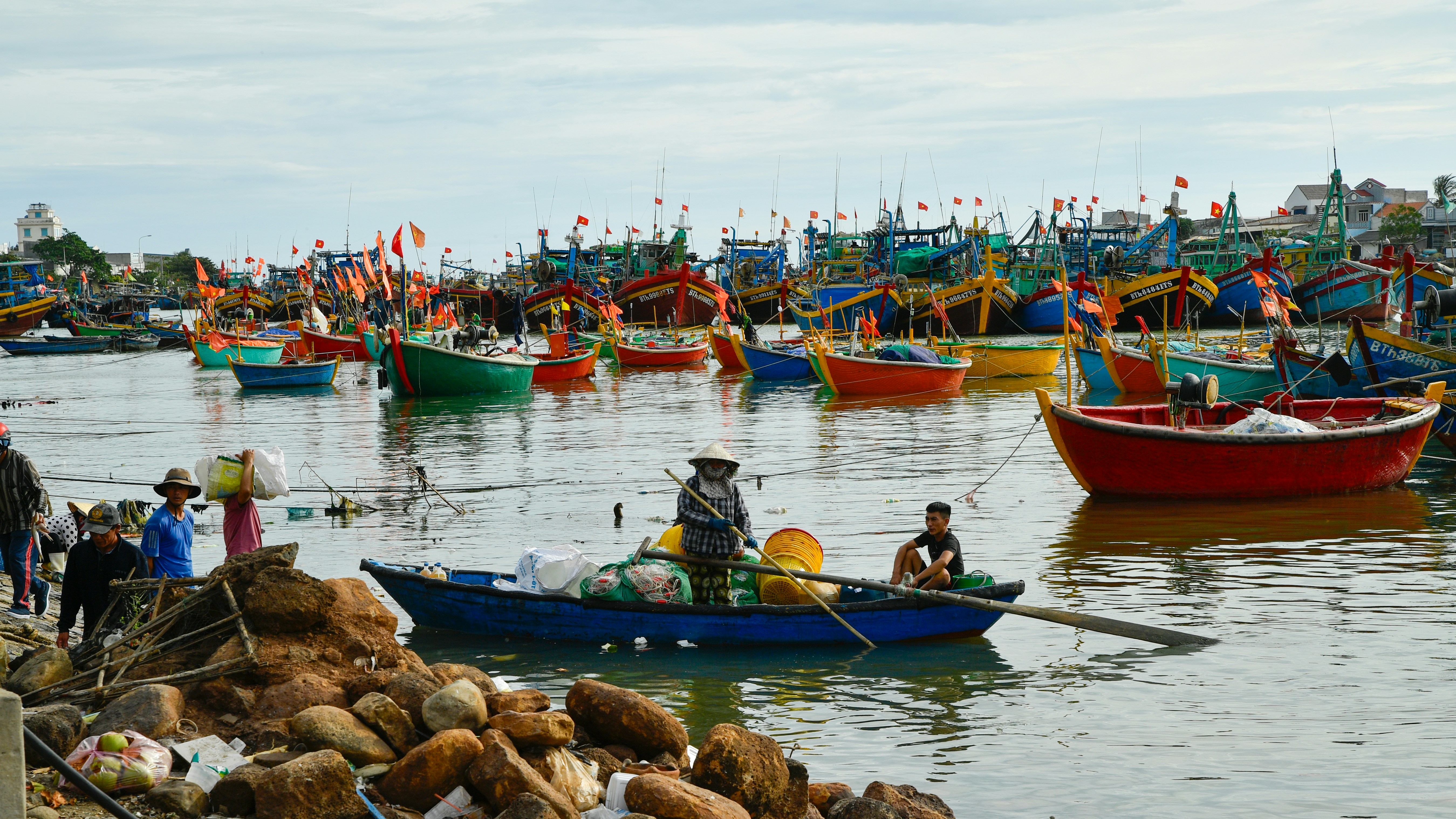colorful fishing boats docked in a fishing harbor