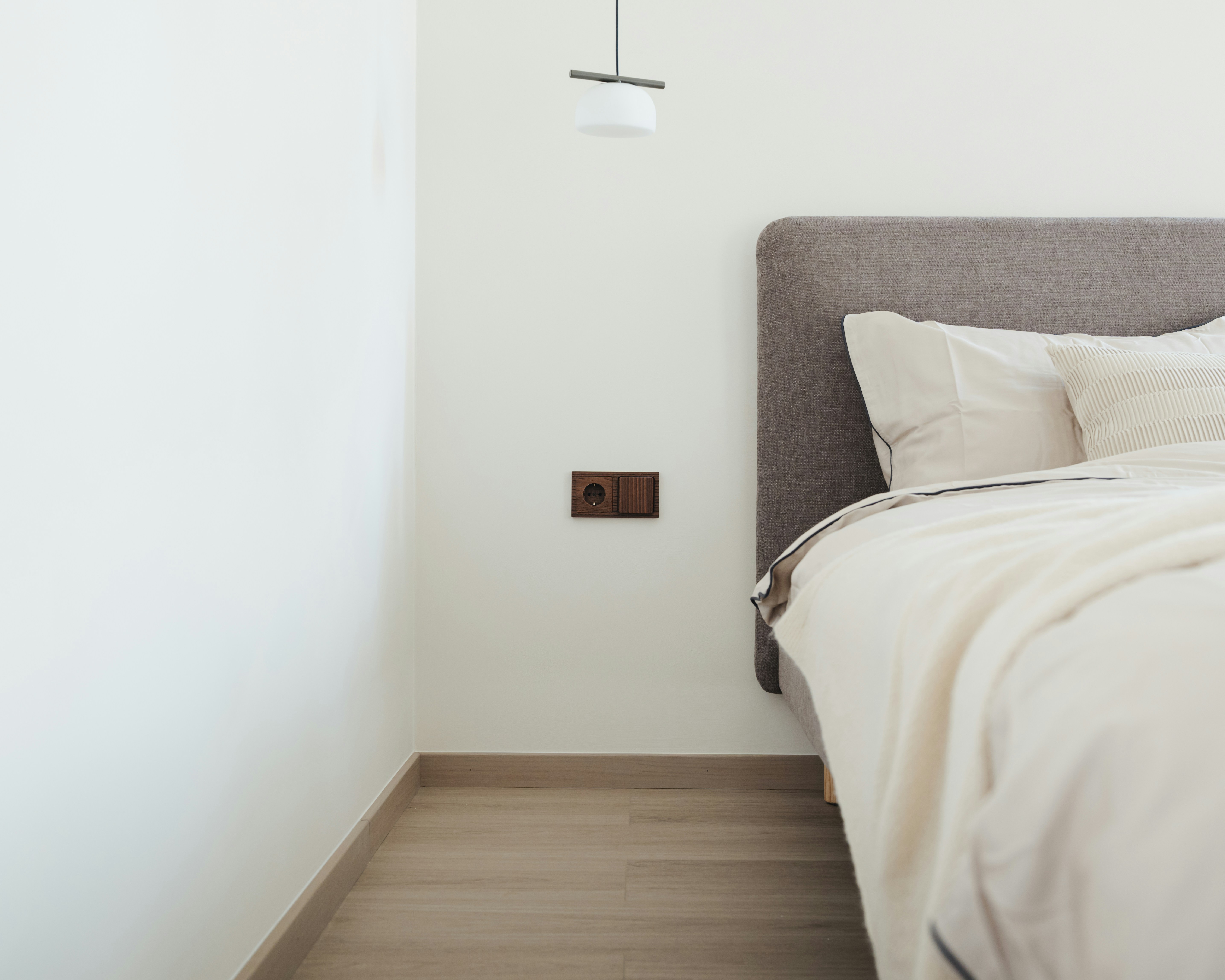 serene bedroom with soft lighting, a comfortable bed, and minimal clutter