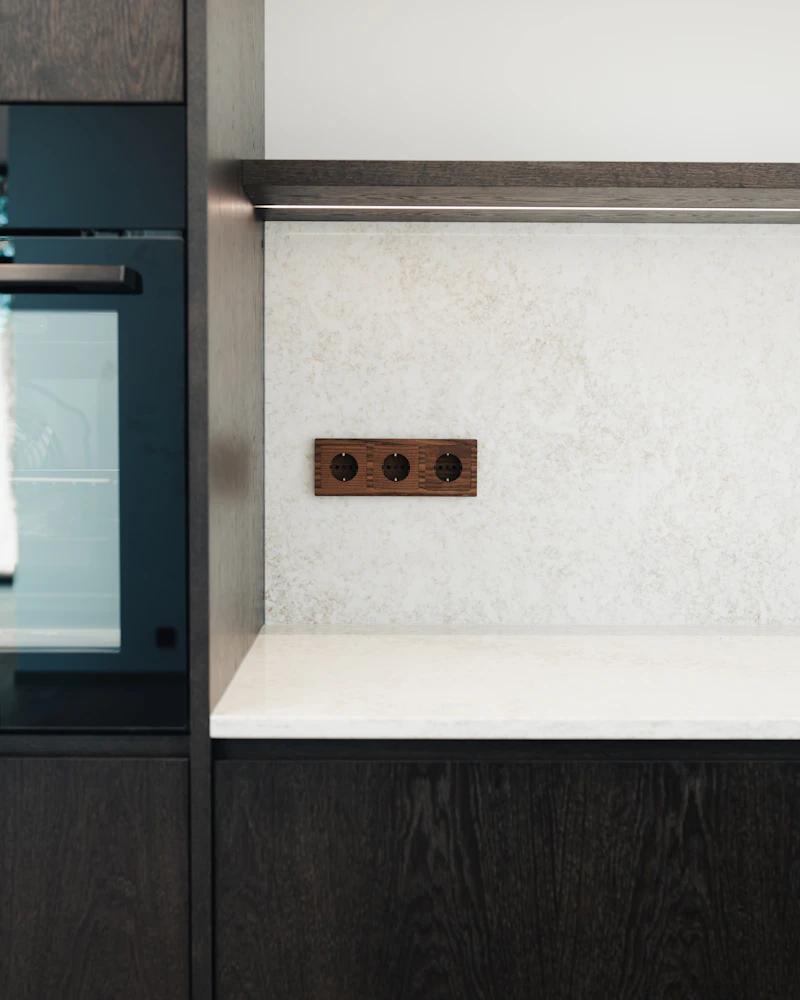 New GFCI outlets installed at countertop level in the finished kitchen