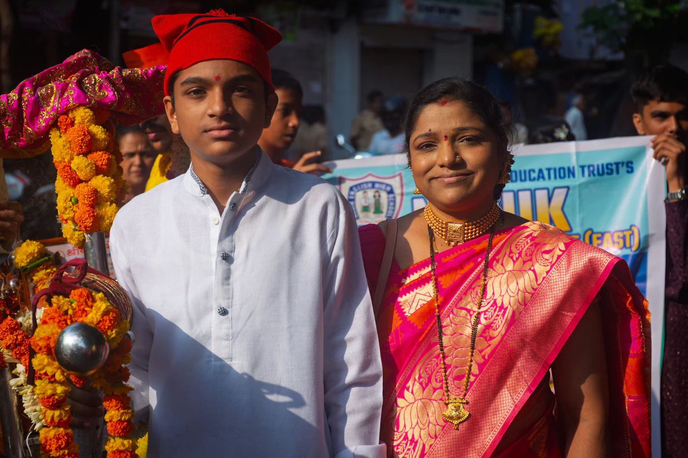 Young graduates in convocation attire on a university campus in India