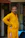 Man in a yellow kurta with hands in pockets
