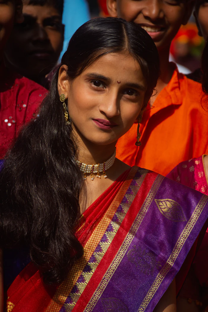 Illustrative stock portrait — Woman in red and purple sari