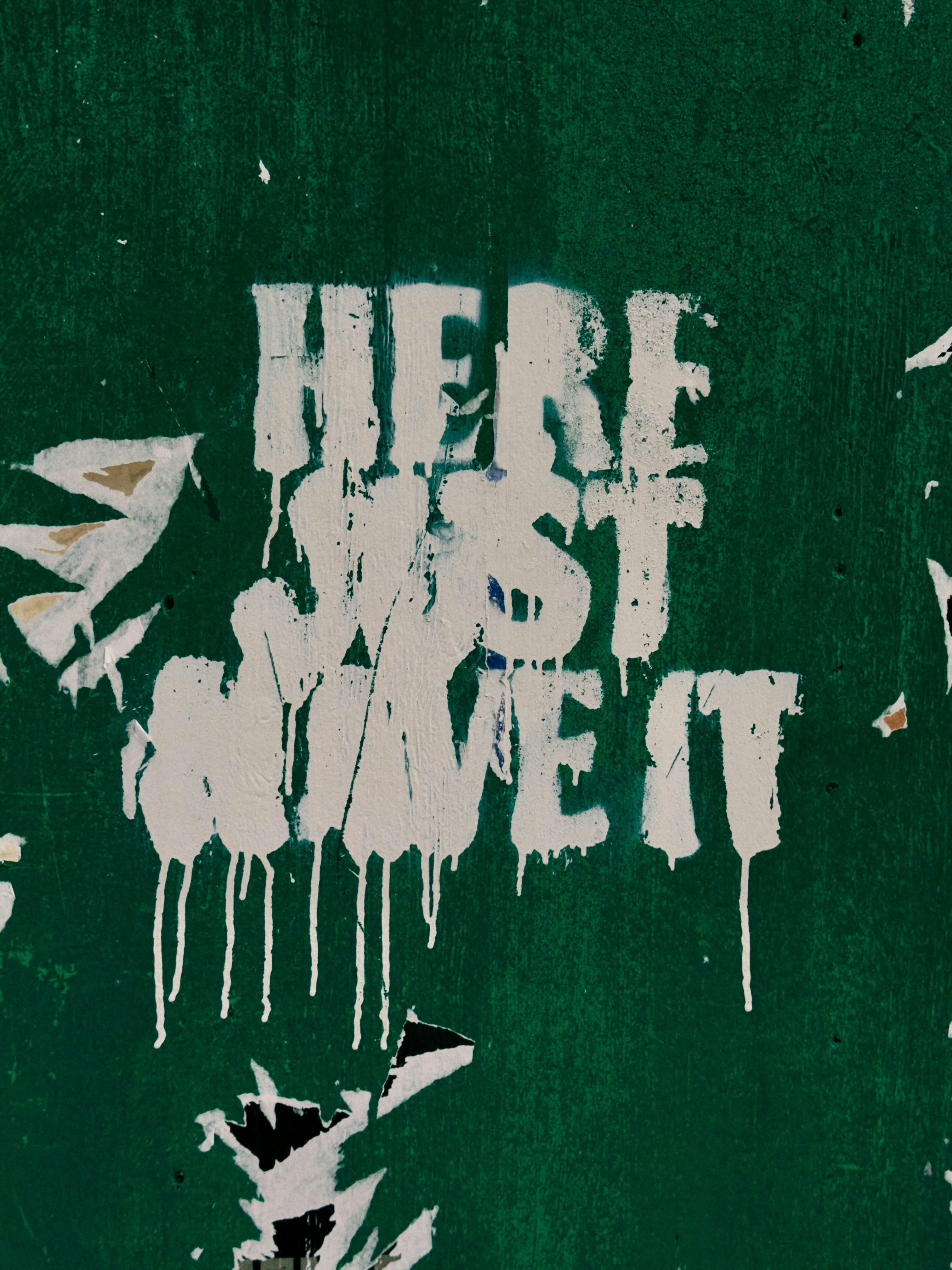 White text on green wall says "here just move it"