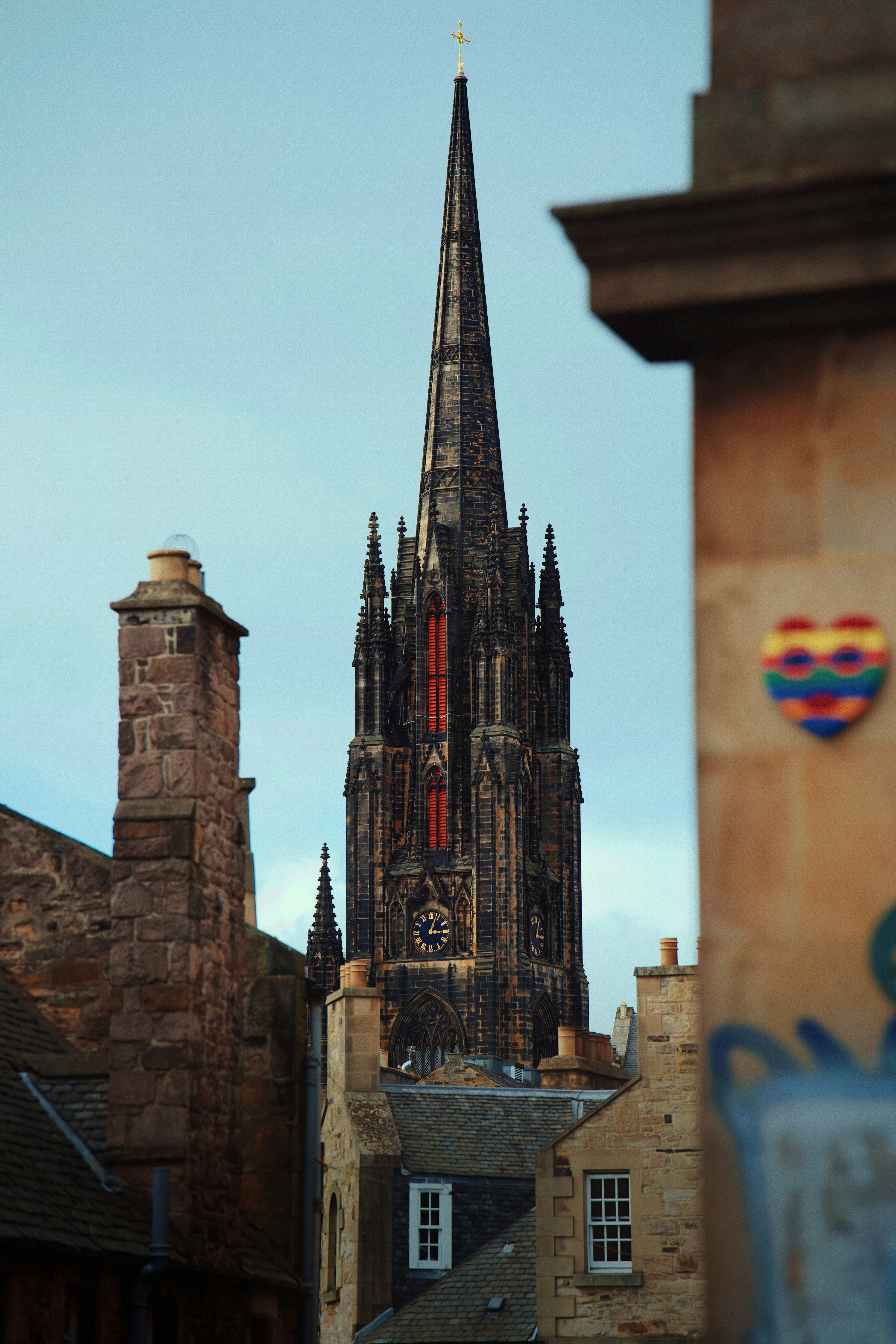Gothic church spire framed by old buildings