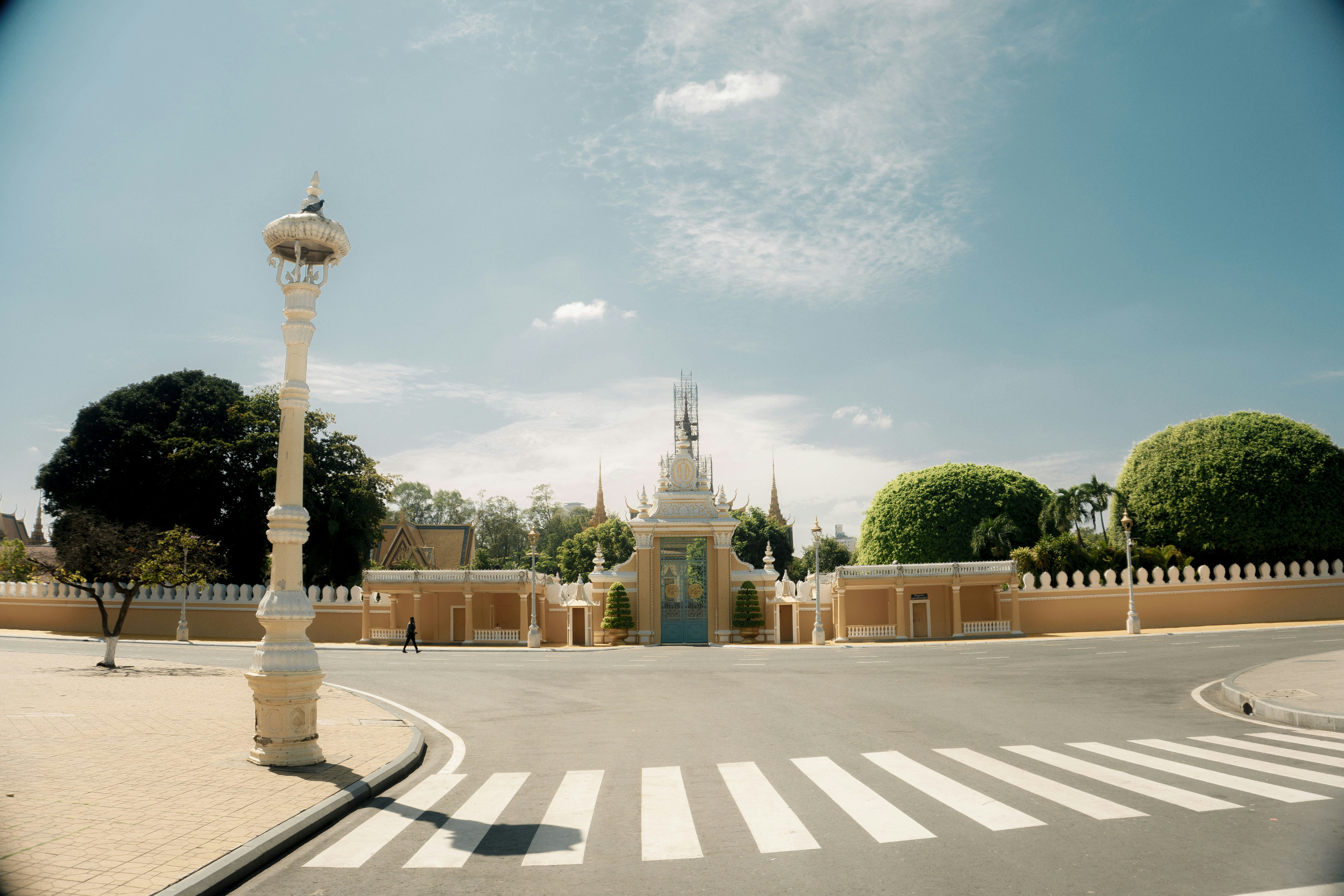 Grand entrance to a building with ornate lamppost