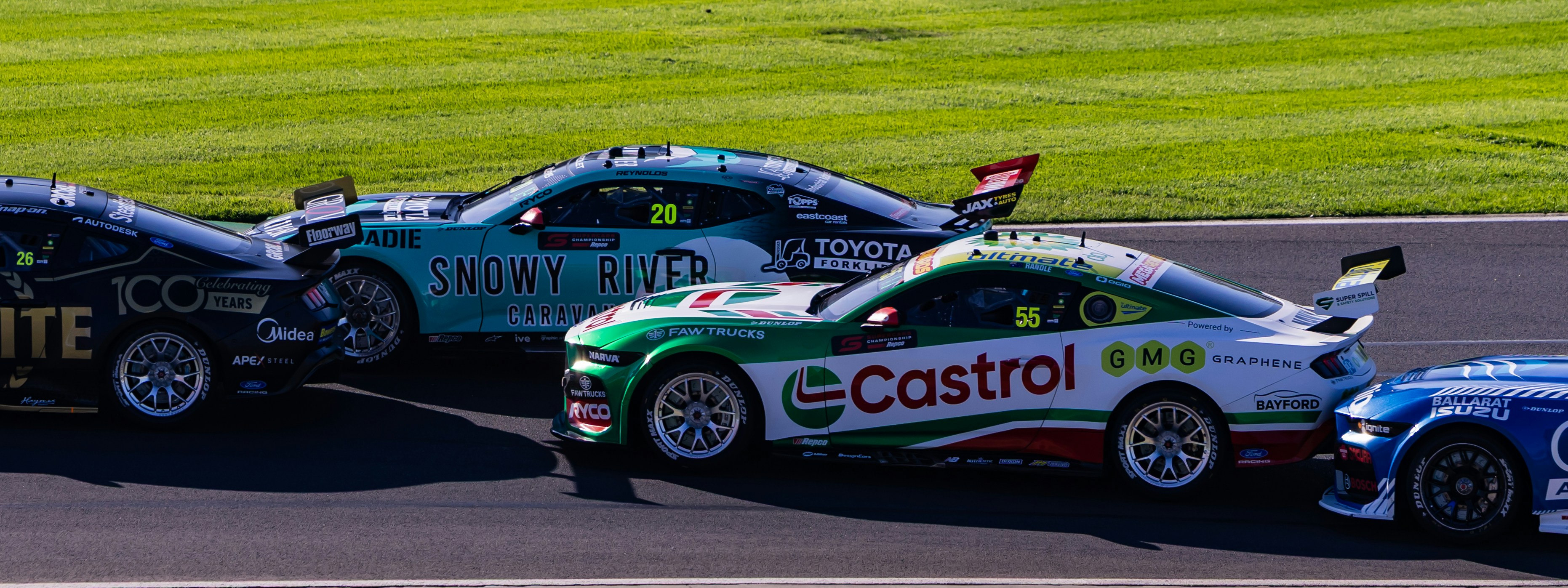 Race cars competing on a track