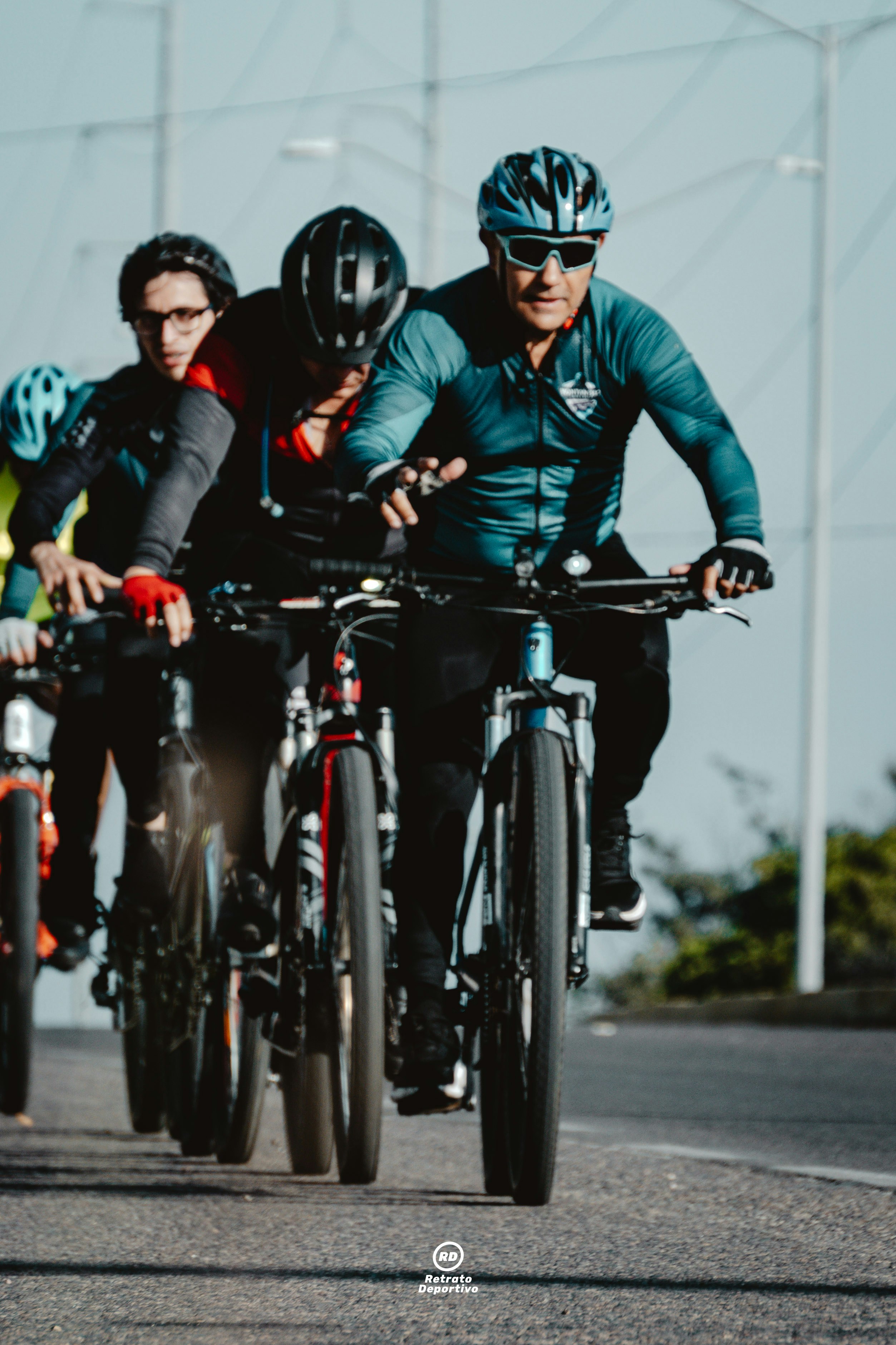Group of cyclists riding on a paved road