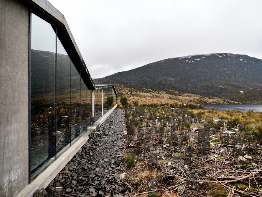 Modern building with large windows overlooking a landscape