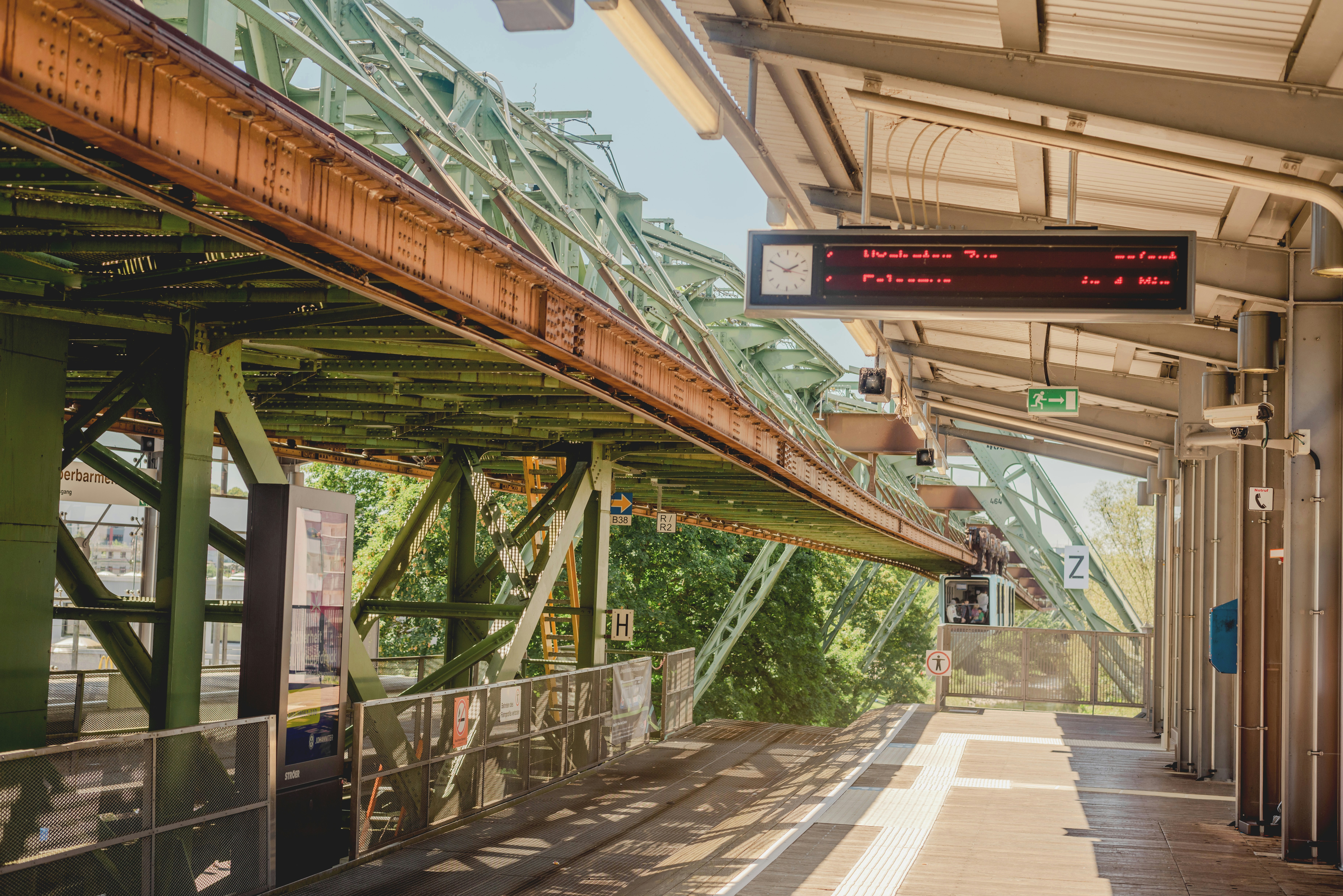 Suspended monorail train track above a station platform