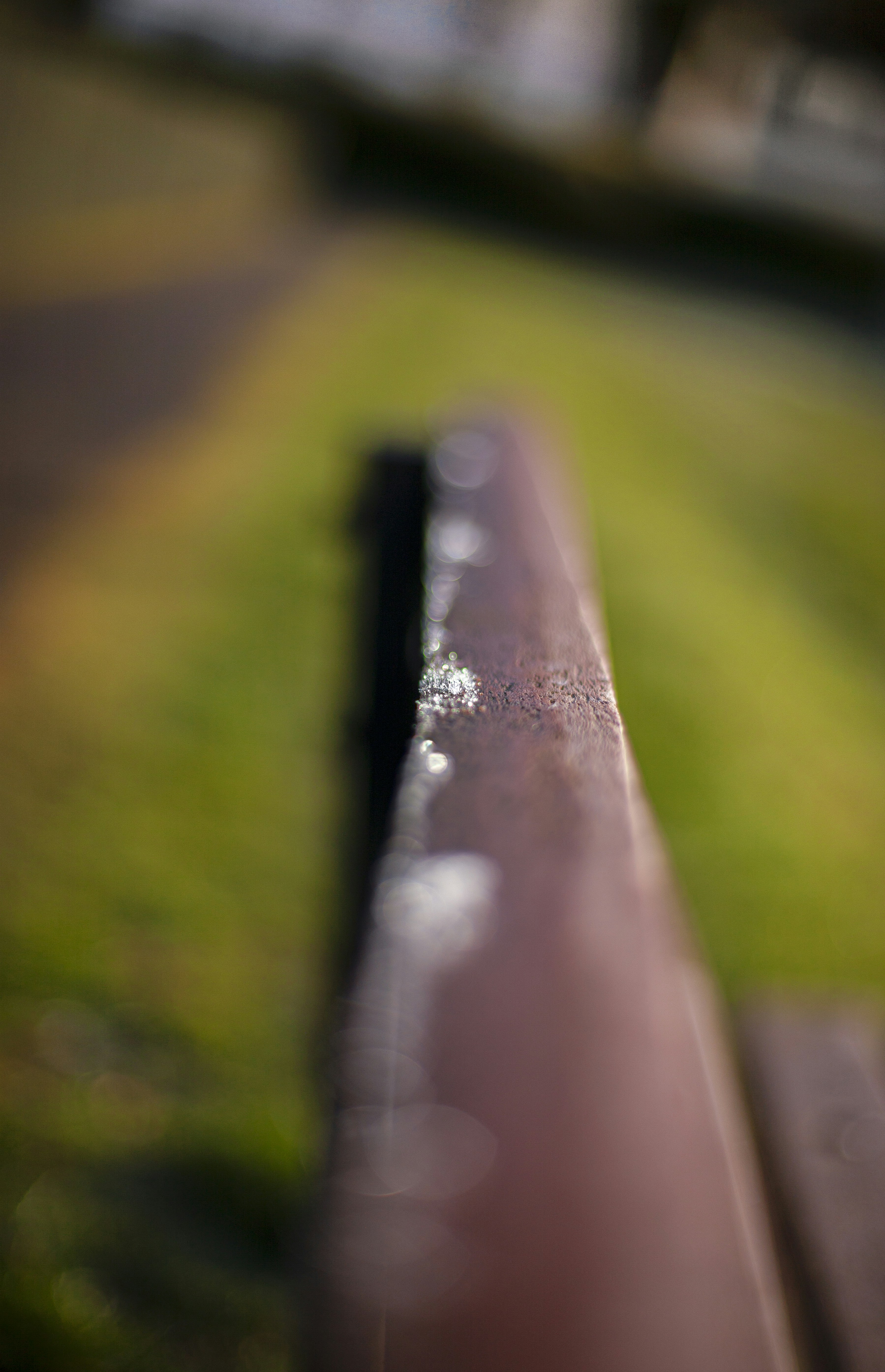 Close-up of a rusty metal railing outdoors