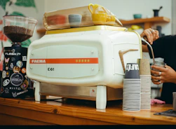 Espresso machine and coffee grinder in a cafe.