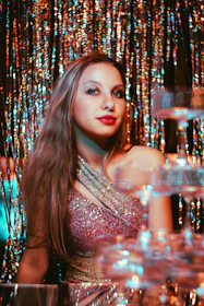 Young woman in sparkling dress at a party