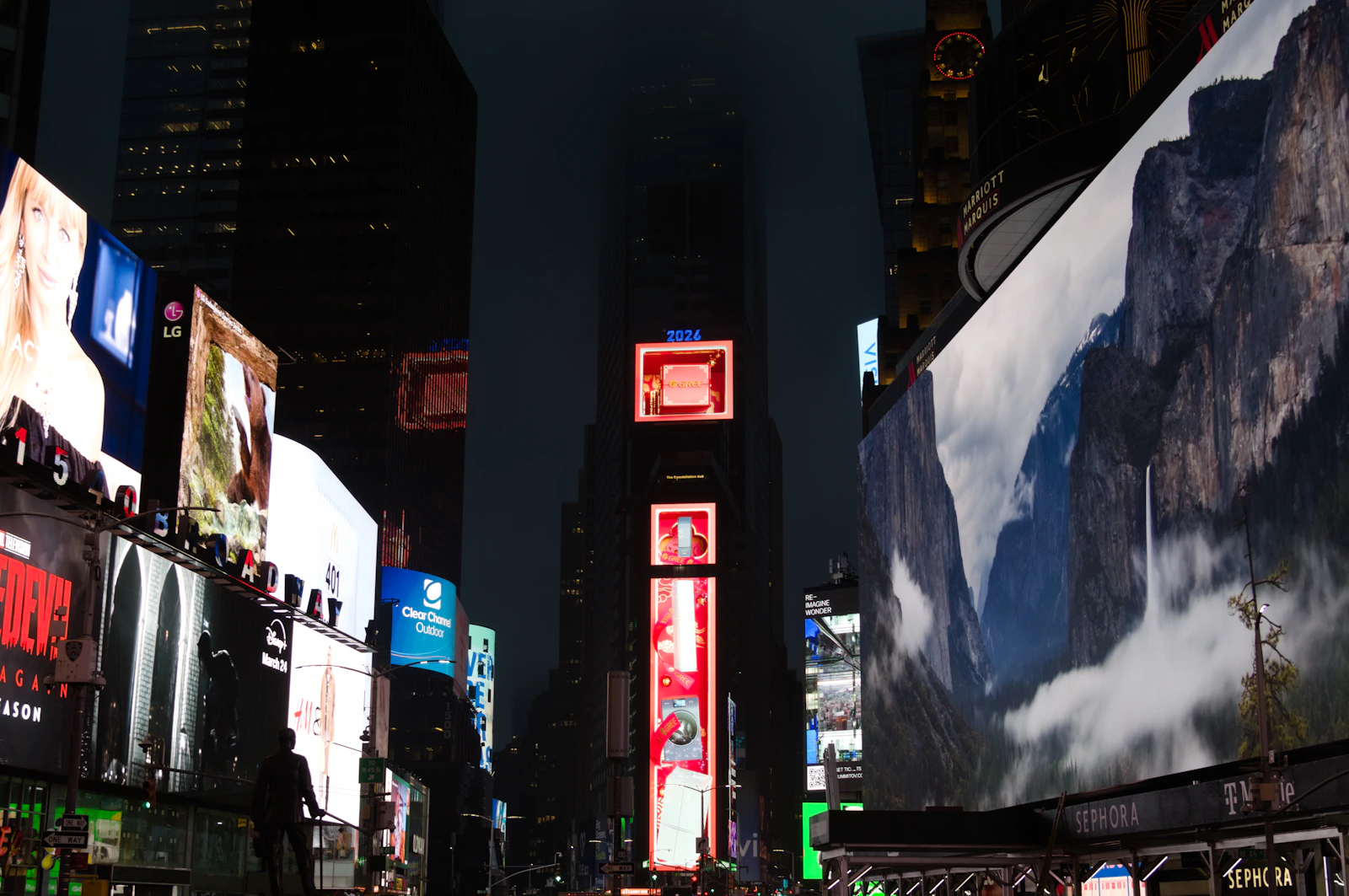 Vibrant cityscape with illuminated billboards at night